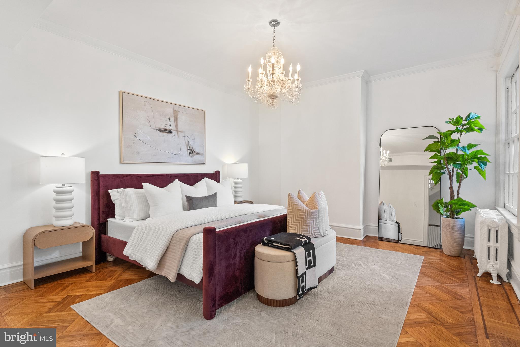 2125 Bancroft Place Northwest Washington, DC 20008 - Photo 24 of 48 a bedroom with a bed and a chandelier