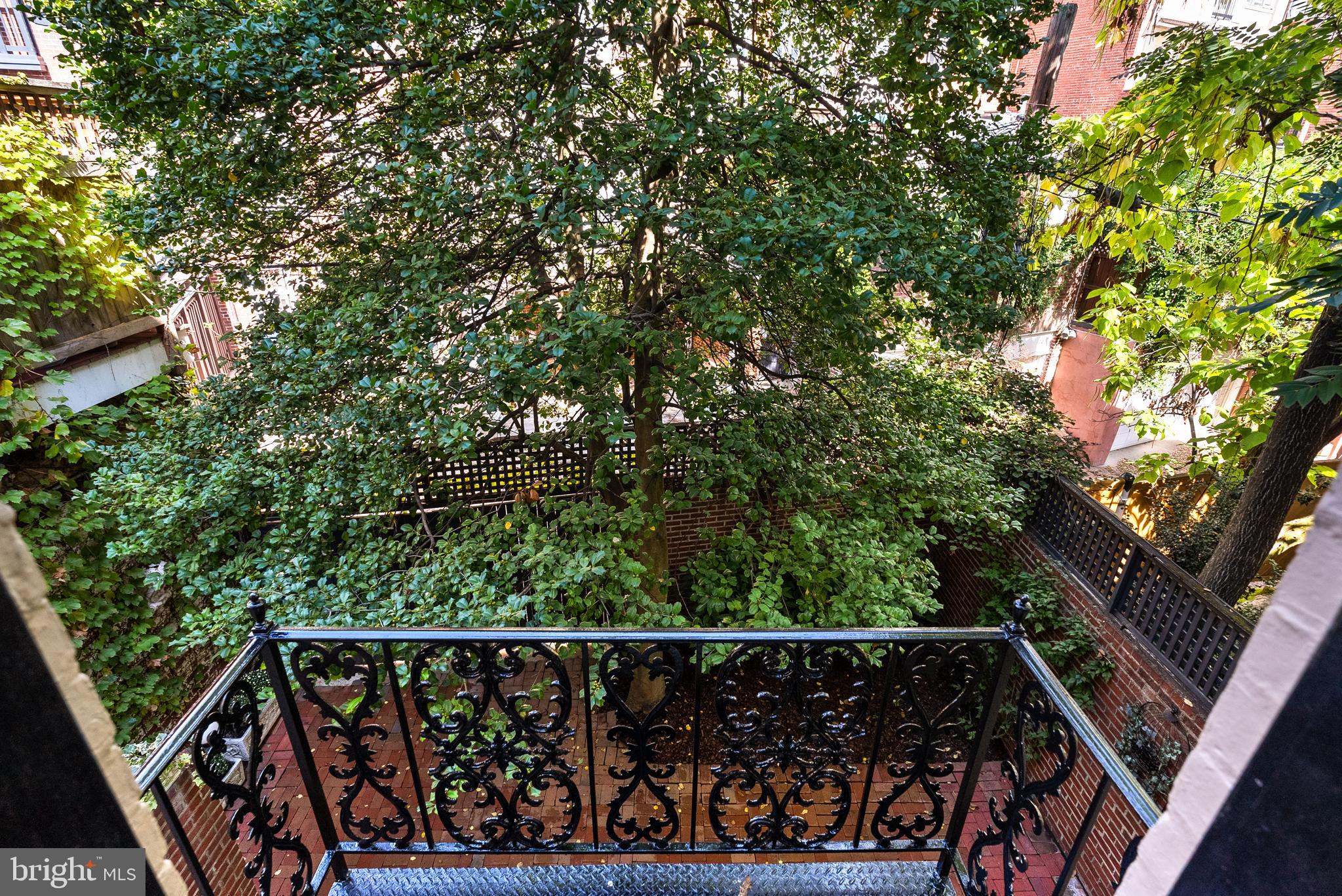 2125 Bancroft Place Northwest Washington, DC 20008 - Photo 28 of 48 a view of balcony with wooden floor and fence