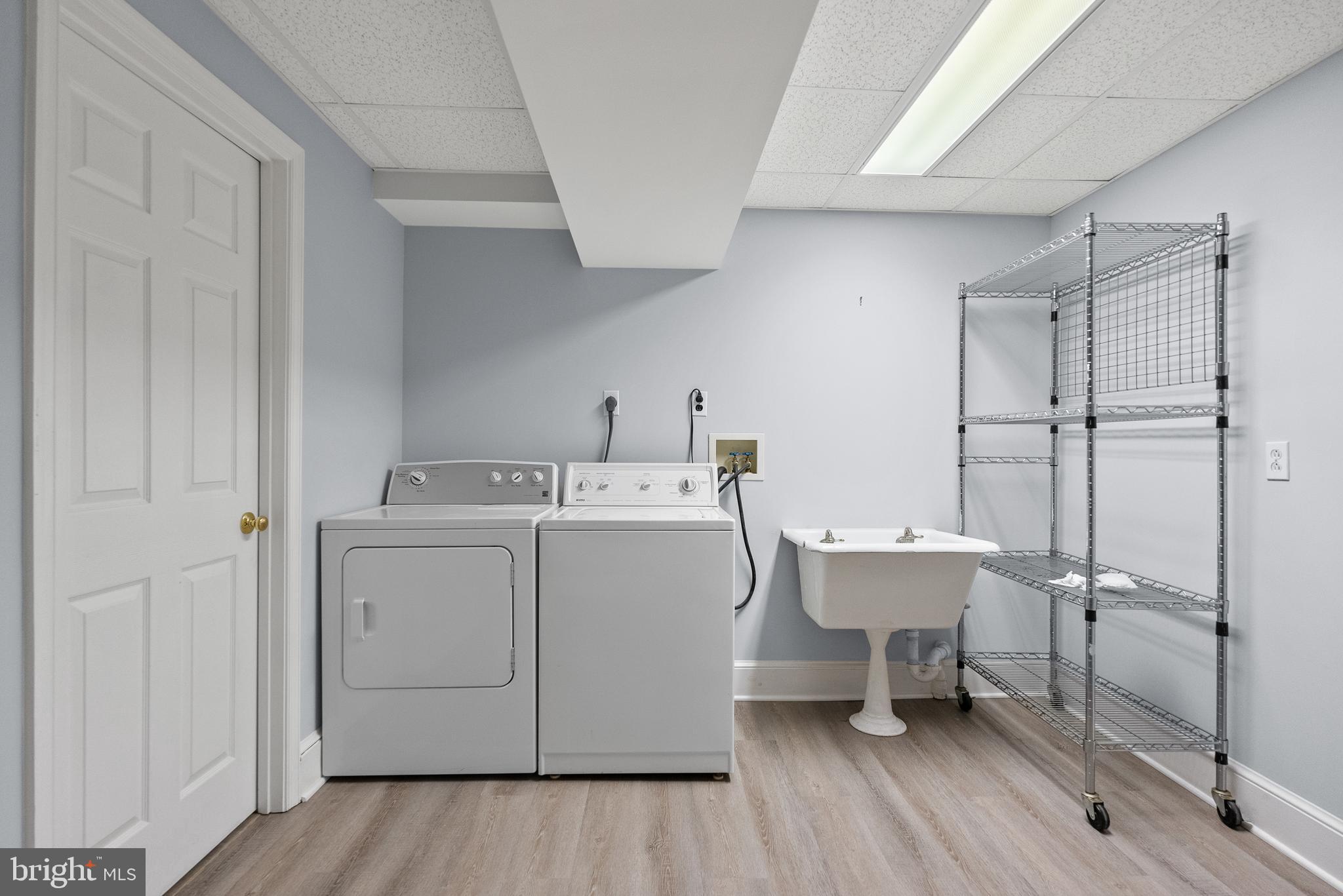 2125 Bancroft Place Northwest Washington, DC 20008 - Photo 42 of 48 a utility room with a sink dryer and washer