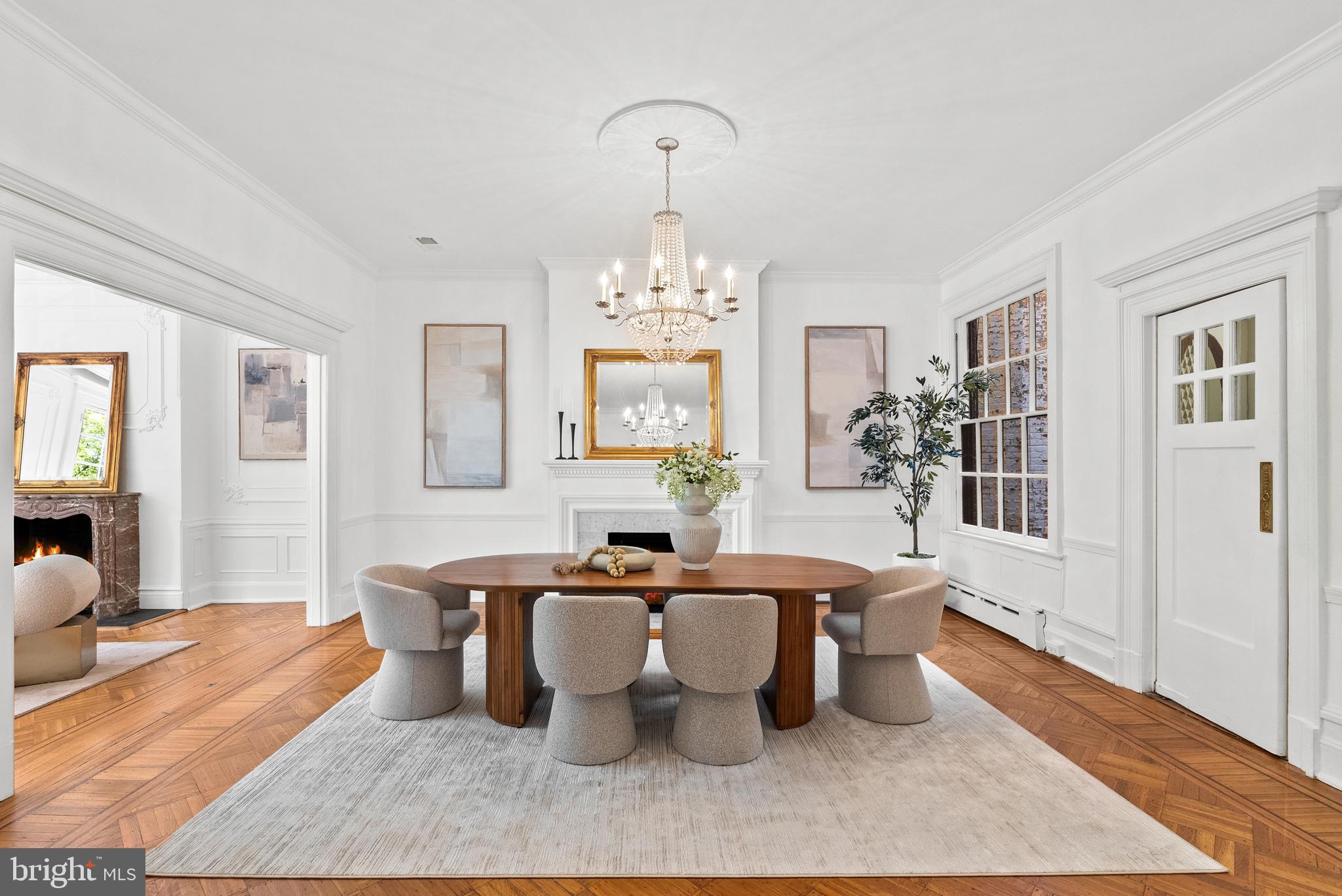 2125 Bancroft Place Northwest Washington, DC 20008 - Photo 6 of 48 a dining room with wooden floor a chandelier a wooden table and chairs