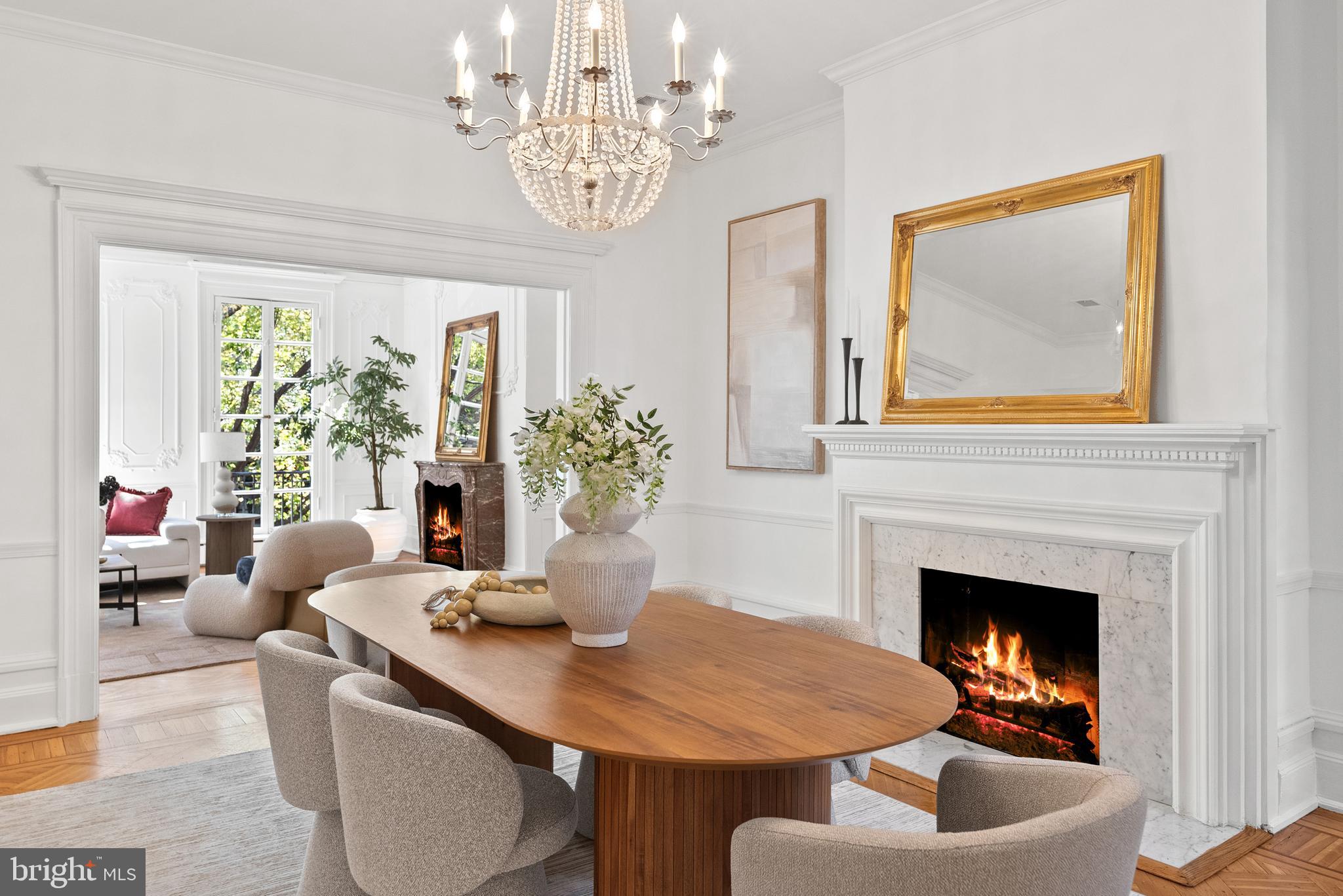 2125 Bancroft Place Northwest Washington, DC 20008 - Photo 7 of 48 a living room with furniture a chandelier and a fireplace