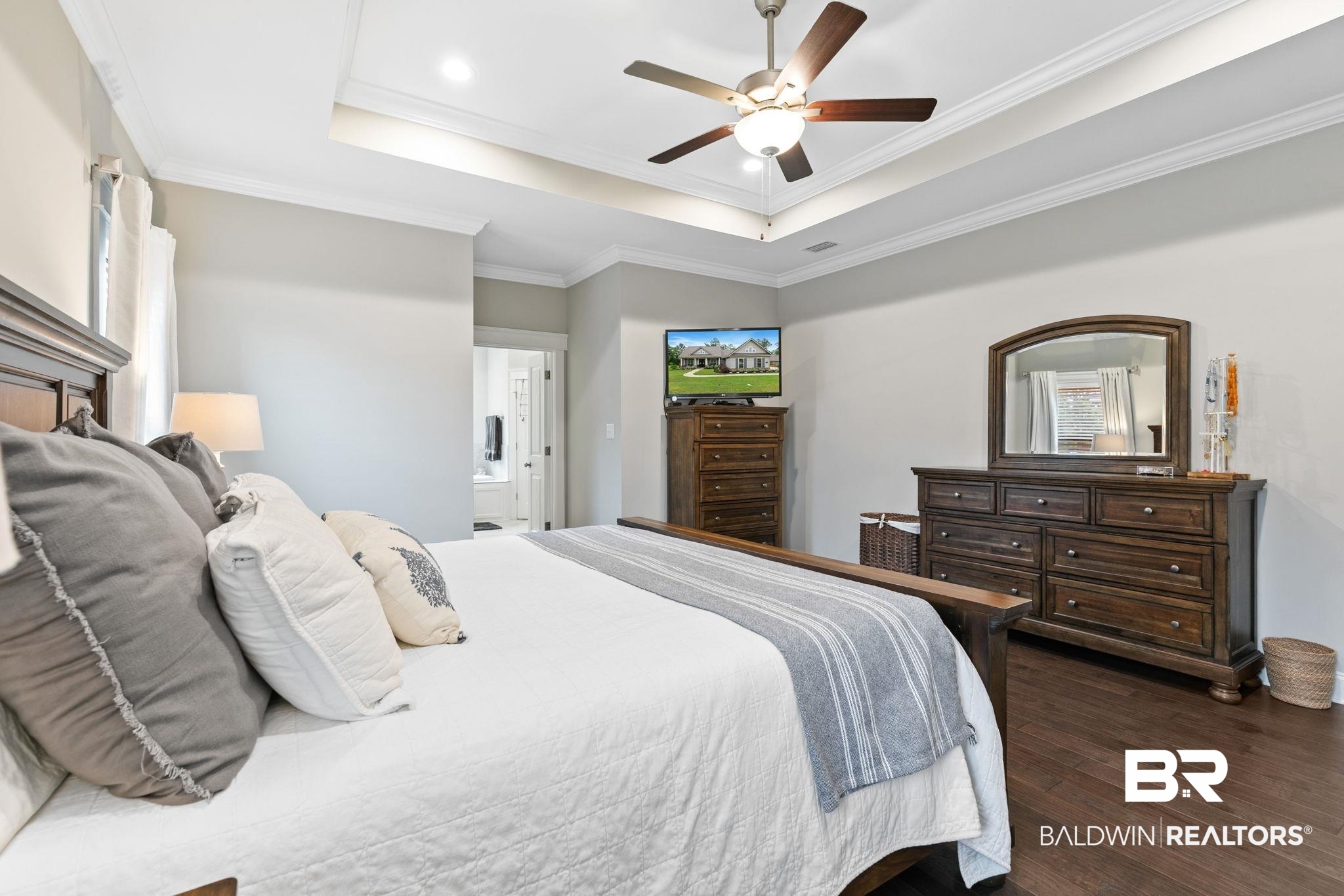 13233 Ibis Boulevard Daphne, AL 36527 - Photo 26 of 100 Spacious room featuring wood-finish flooring, a tray ceiling, recessed lighting, and a ceiling fan with integrated light fixture