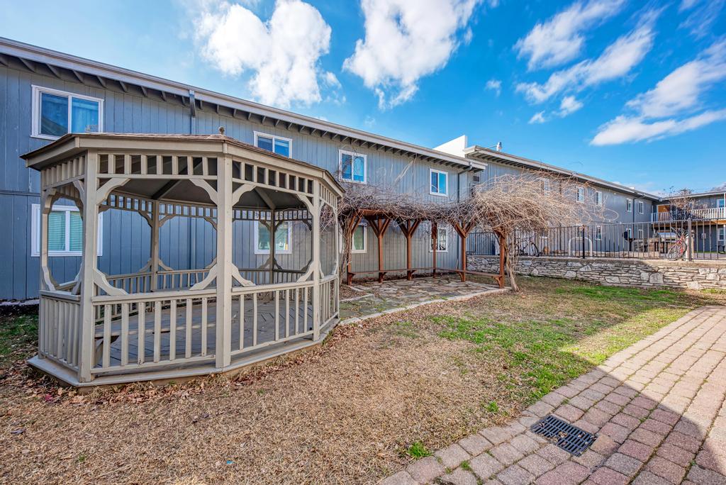 2401 Manor St Road, Unit 118 Austin, TX 78722 - Photo 17 of 17 a view of a house with a yard porch and furniture