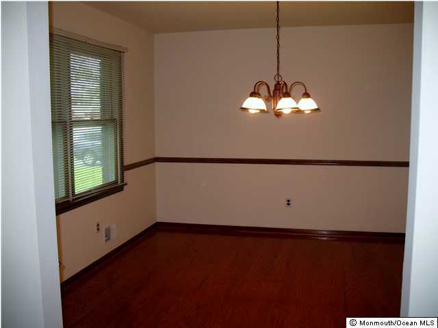 9 Bar Harbor Road South Freehold, NJ 07728 - Photo 3 of 3 a view of a room with a chandelier fan and a window