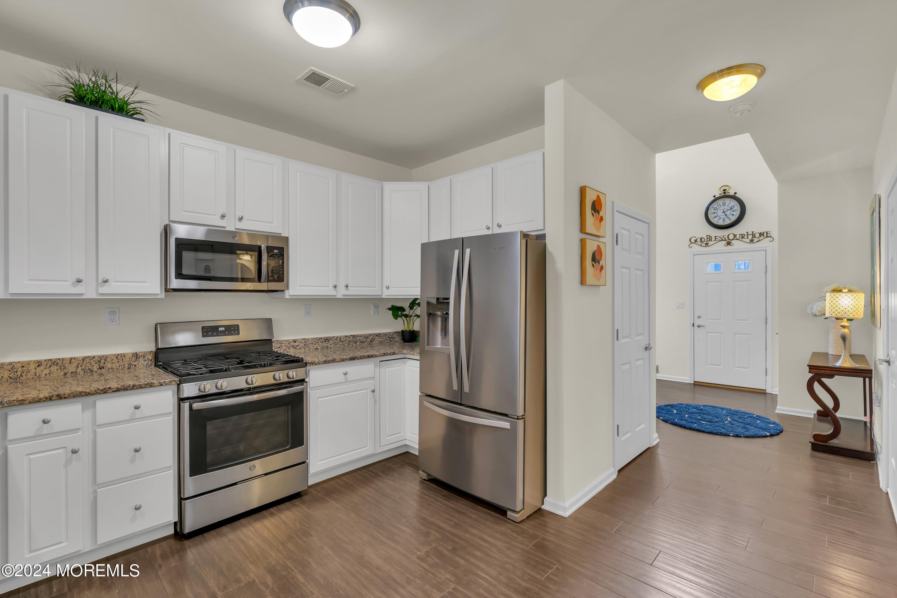 20 Rockingham Way Manchester Township, NJ 08759 - Photo 12 of 40 a kitchen with granite countertop white cabinets and stainless steel appliances
