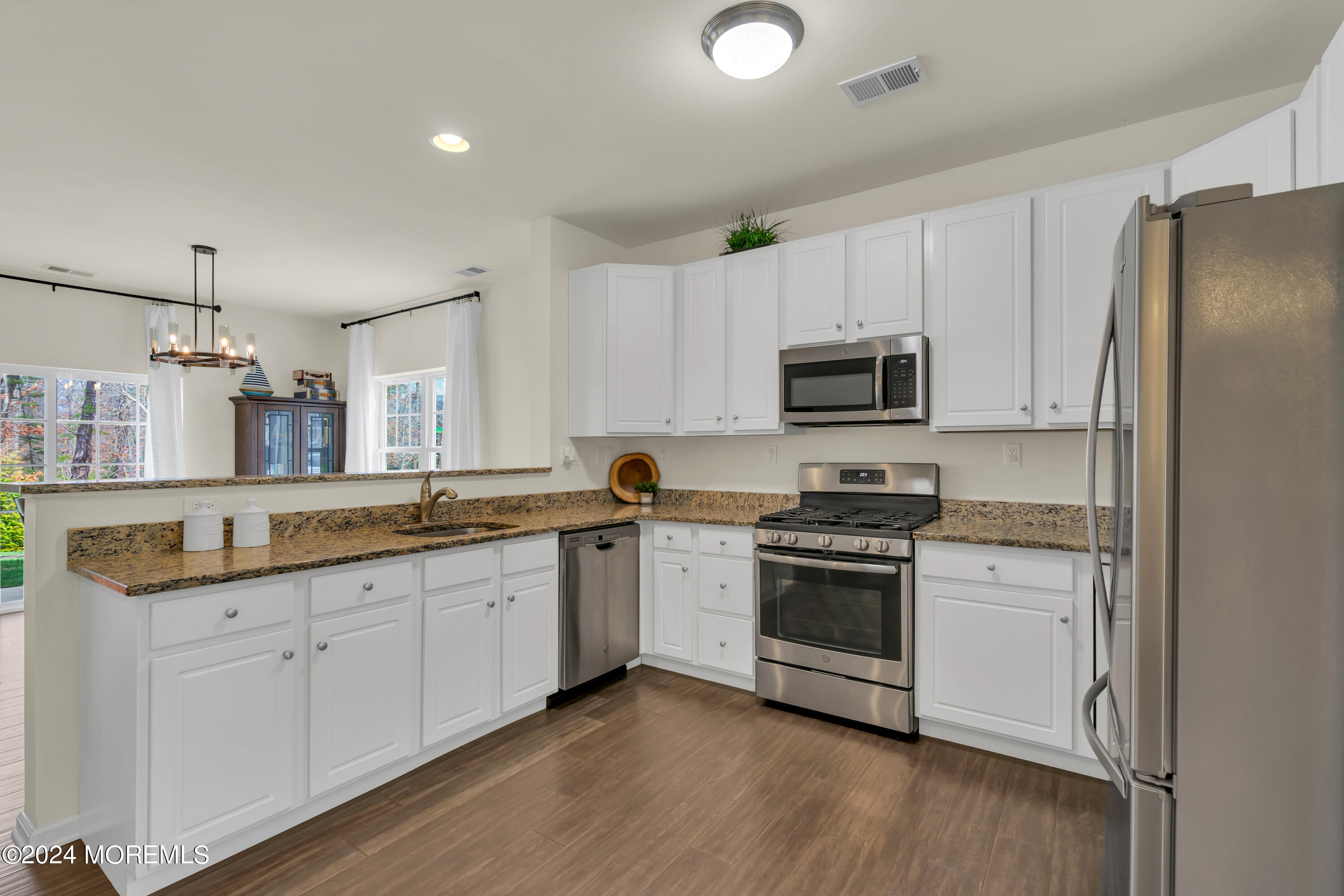 20 Rockingham Way Manchester Township, NJ 08759 - Photo 13 of 40 a kitchen with granite countertop white cabinets and stainless steel appliances