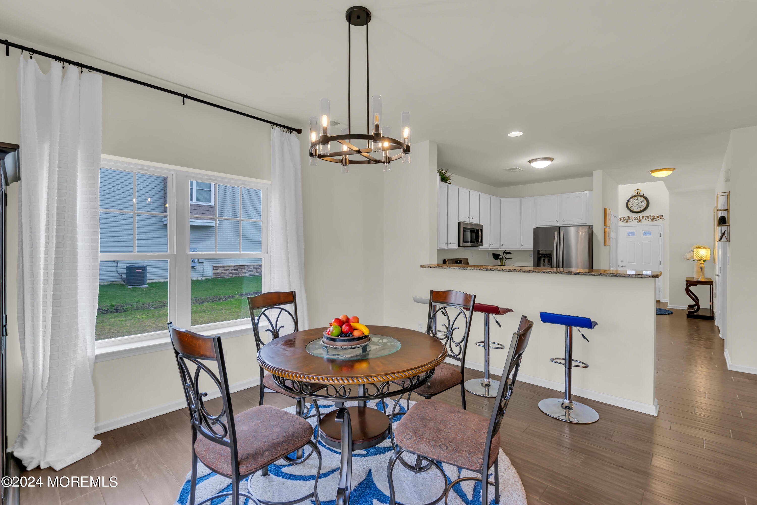 20 Rockingham Way Manchester Township, NJ 08759 - Photo 18 of 40 a view of a dining room with furniture and wooden floor
