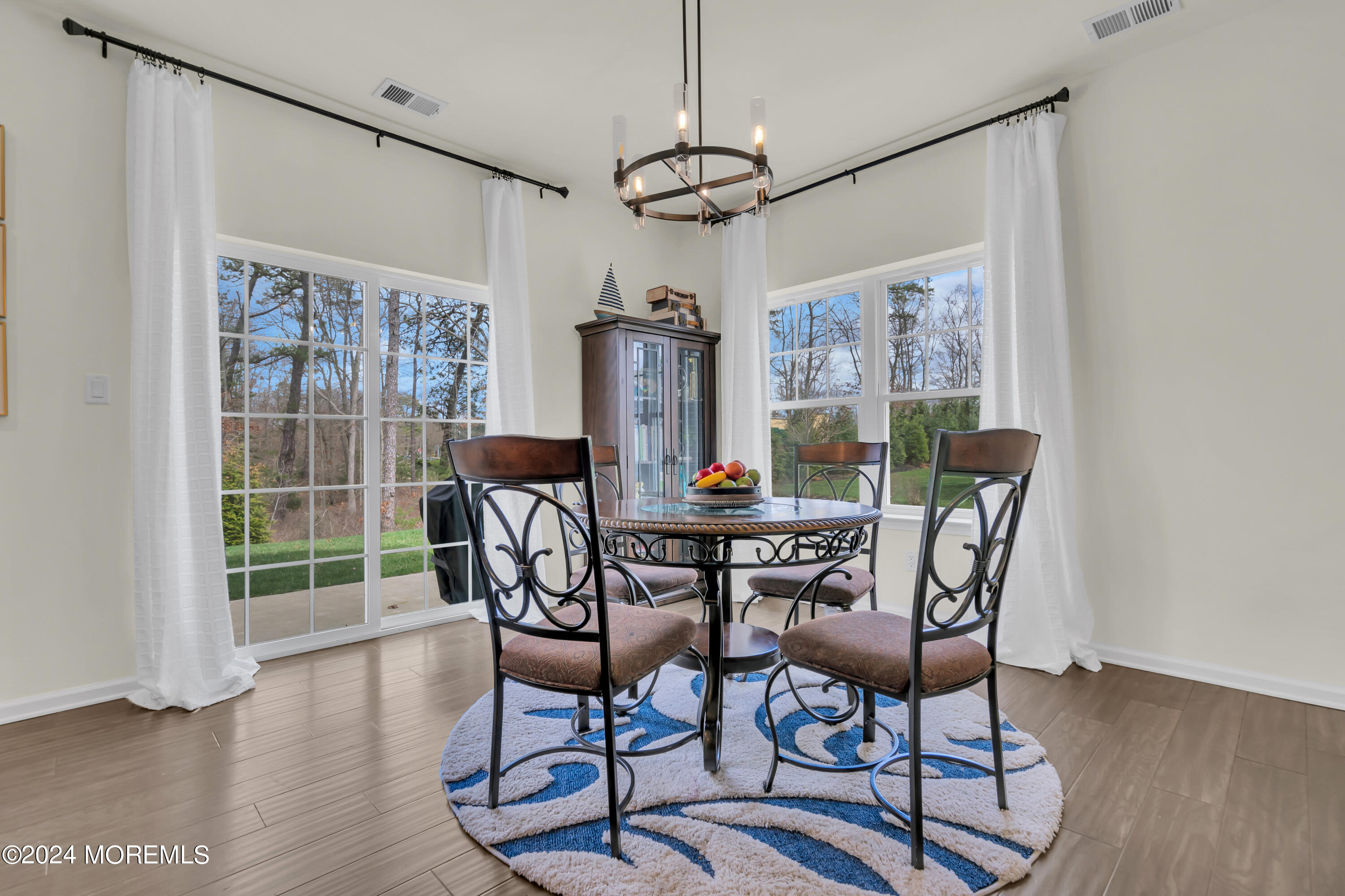 20 Rockingham Way Manchester Township, NJ 08759 - Photo 19 of 40 a view of a dining room with furniture window and wooden floor