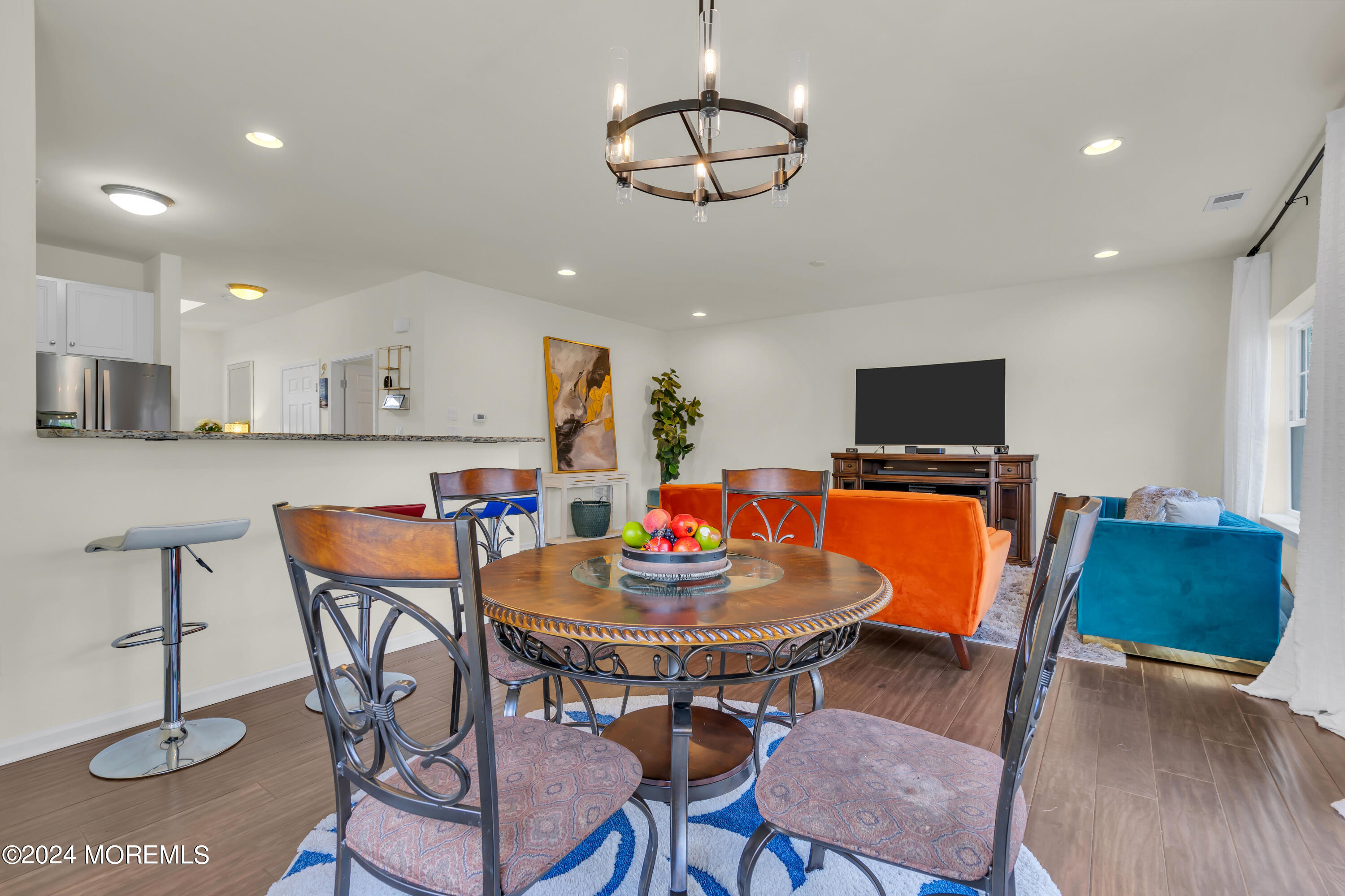 20 Rockingham Way Manchester Township, NJ 08759 - Photo 20 of 40 a view of a dining room with furniture and wooden floor