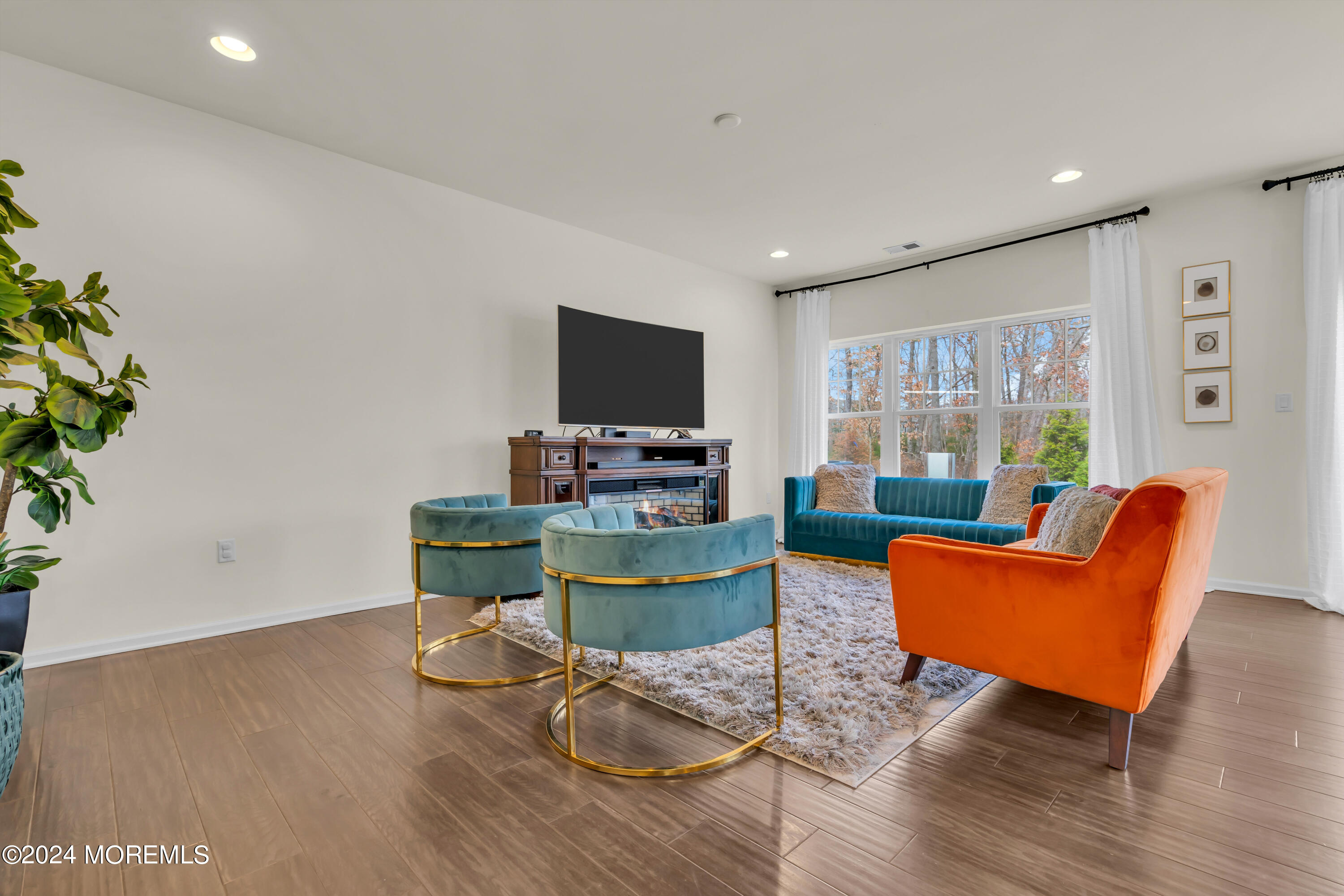 20 Rockingham Way Manchester Township, NJ 08759 - Photo 22 of 40 a living room with furniture and a flat screen tv