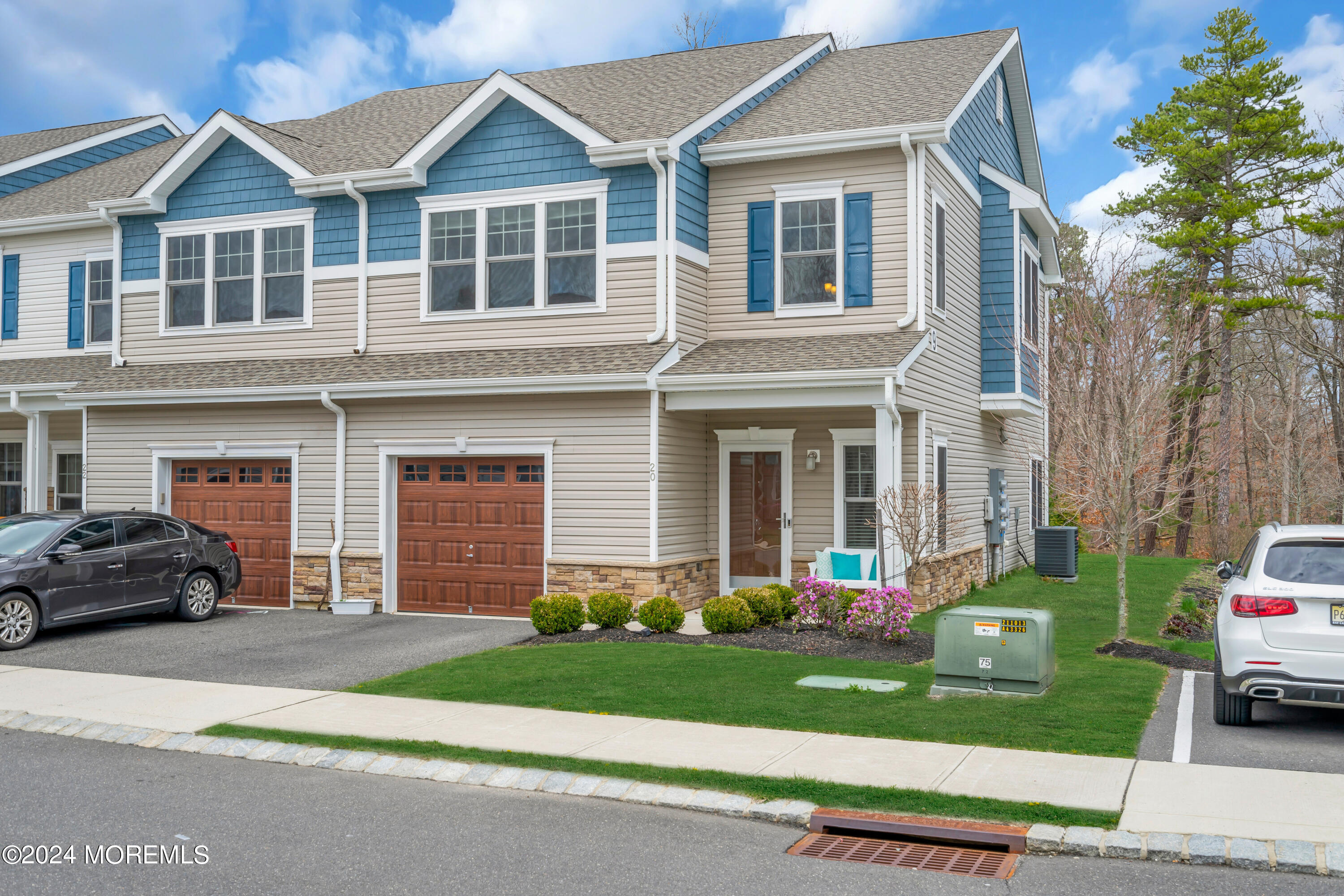 20 Rockingham Way Manchester Township, NJ 08759 - Photo 3 of 40 a front view of a house with a yard