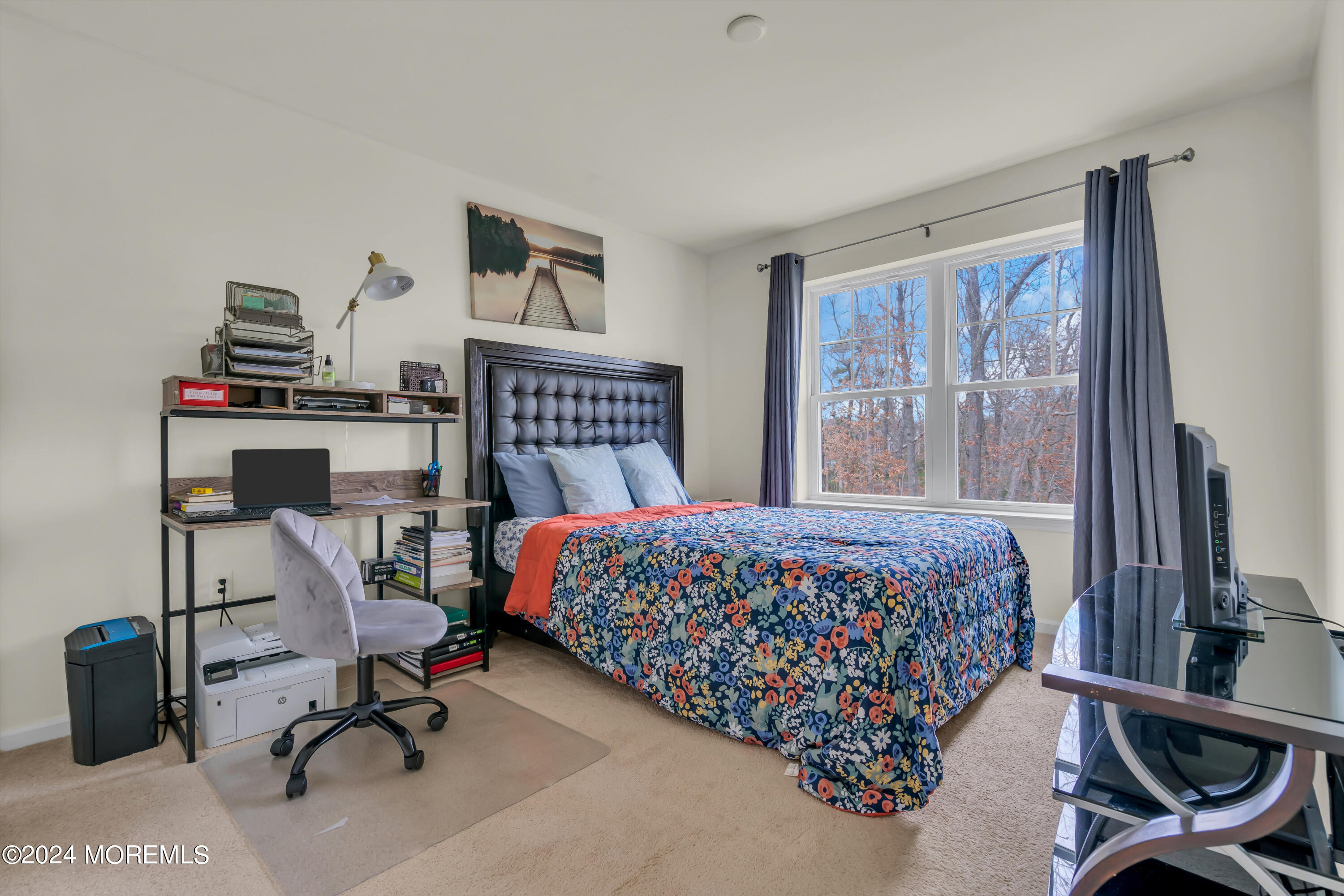 20 Rockingham Way Manchester Township, NJ 08759 - Photo 34 of 40 a bedroom with a bed a desk chair and a window