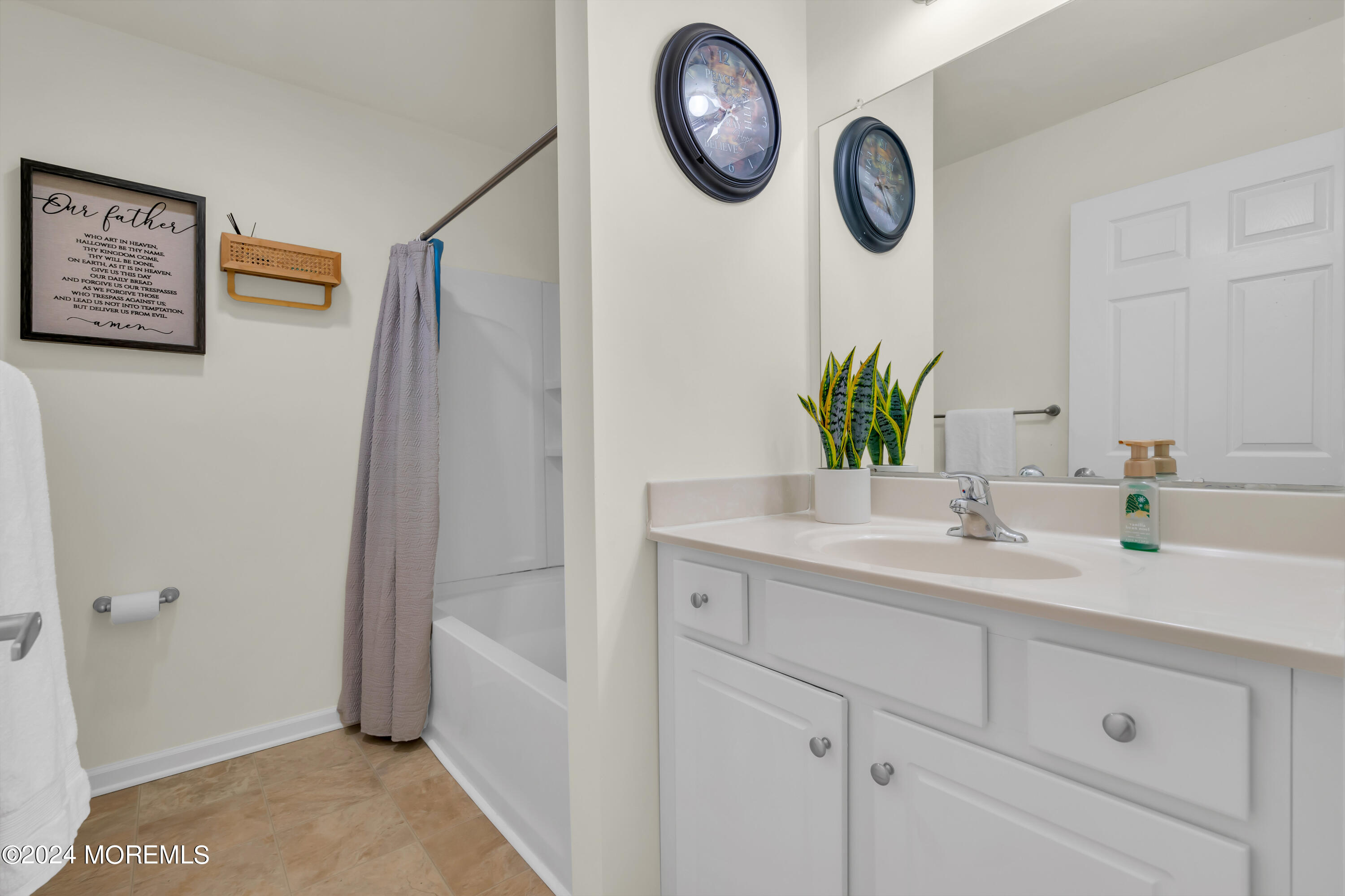 20 Rockingham Way Manchester Township, NJ 08759 - Photo 35 of 40 a bathroom with a sink and a mirror