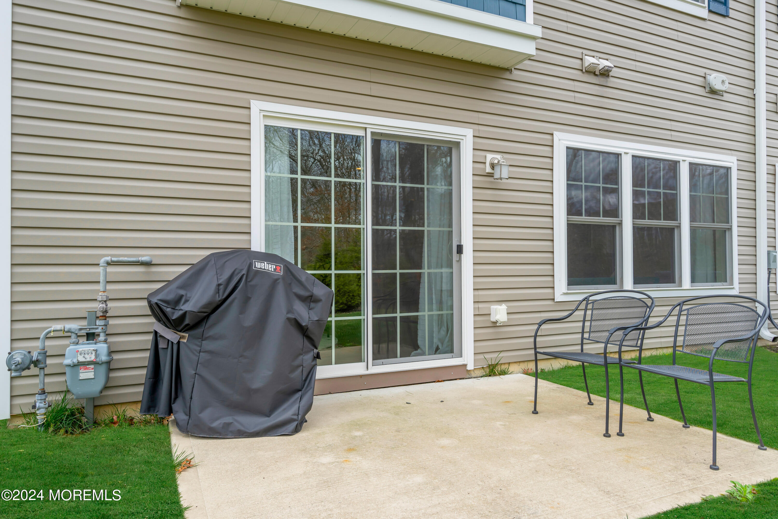 20 Rockingham Way Manchester Township, NJ 08759 - Photo 39 of 40 a view of a house with a backyard and a window