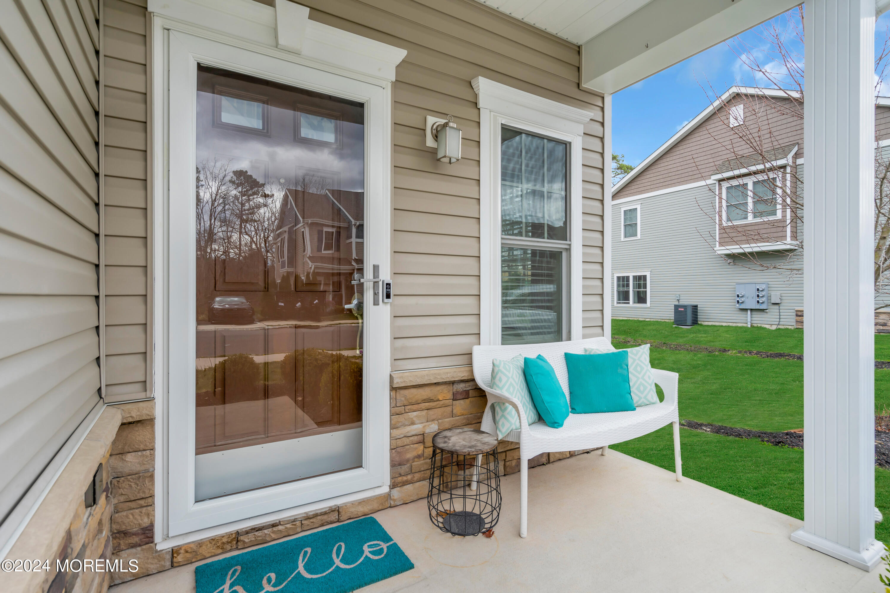 20 Rockingham Way Manchester Township, NJ 08759 - Photo 5 of 40 a view of porch with a bench and chair