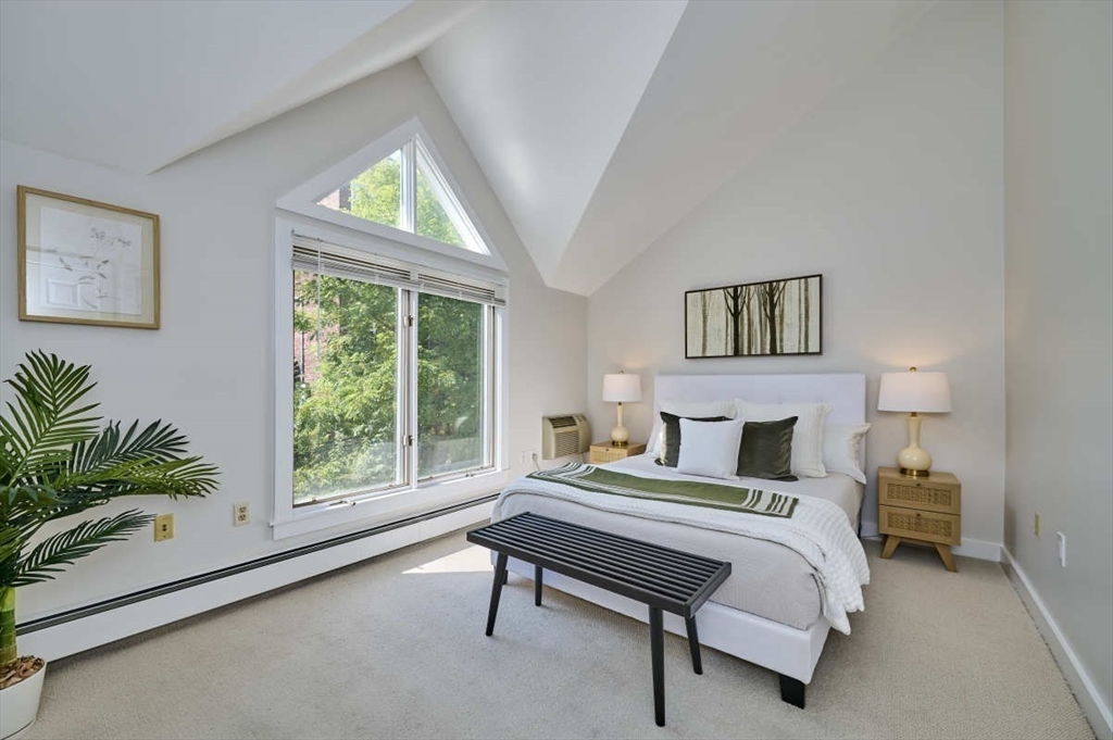 626 Washington Street, Unit 4 Brookline, MA 02446 - Photo 15 of 37 a bedroom with furniture and a large window