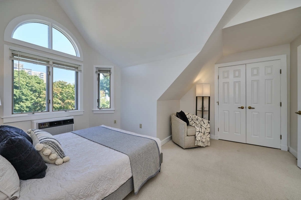 626 Washington Street, Unit 4 Brookline, MA 02446 - Photo 24 of 37 a bedroom with a bed and window