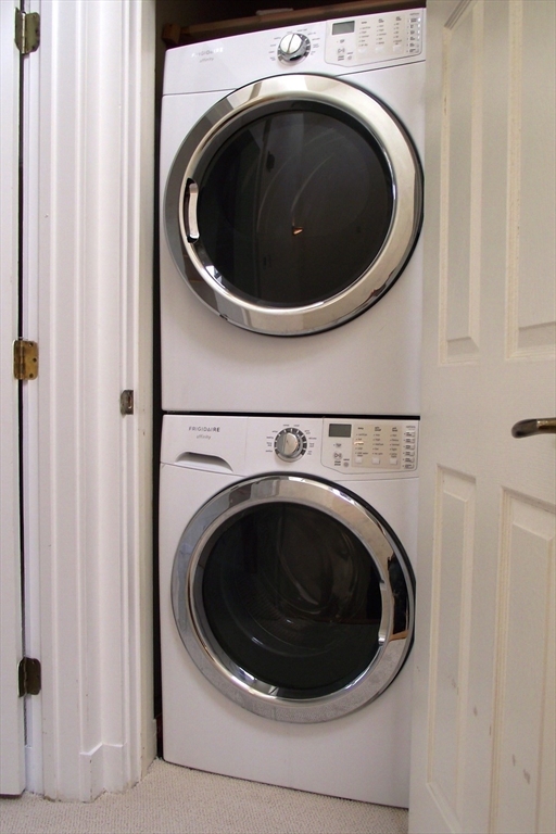 626 Washington Street, Unit 4 Brookline, MA 02446 - Photo 27 of 37 a utility room with dryer and washer