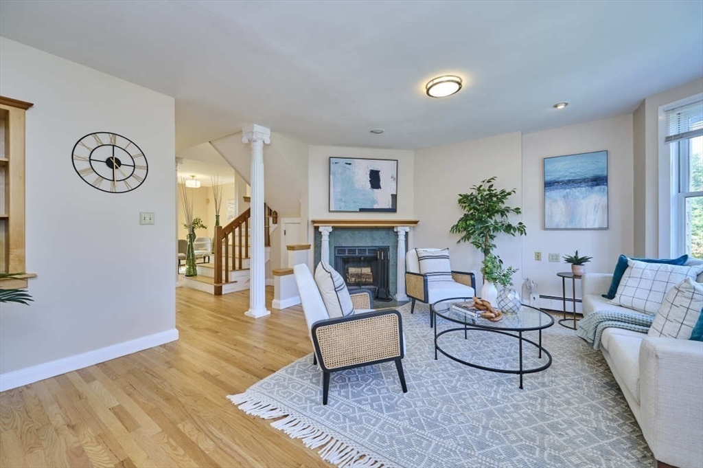 626 Washington Street, Unit 4 Brookline, MA 02446 - Photo 28 of 37 a living room with furniture and a fireplace