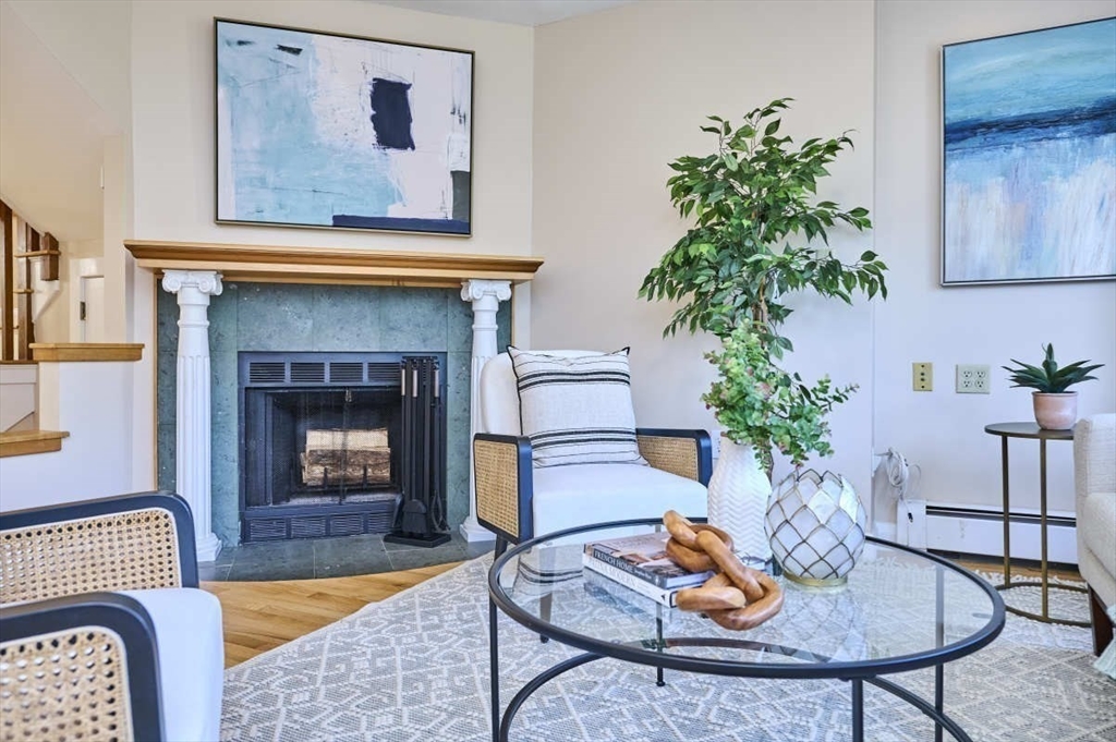 626 Washington Street, Unit 4 Brookline, MA 02446 - Photo 3 of 37 a living room with furniture fireplace and potted plant