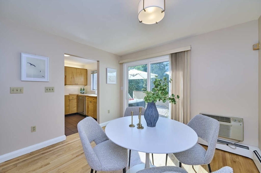 626 Washington Street, Unit 4 Brookline, MA 02446 - Photo 31 of 37 a dining room with furniture a window and wooden floor