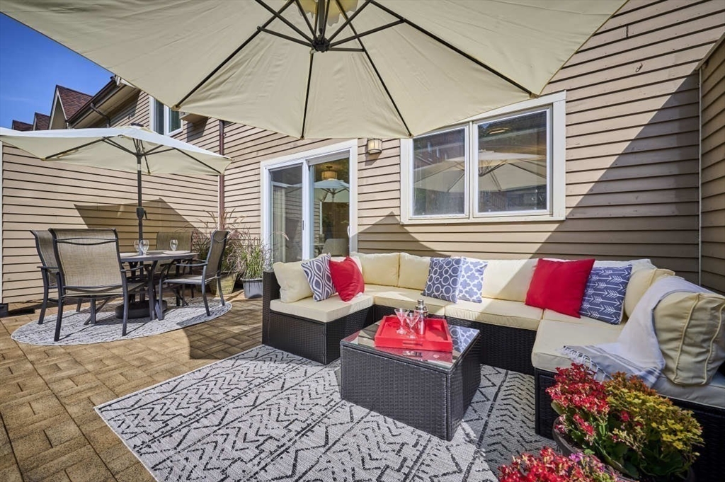 626 Washington Street, Unit 4 Brookline, MA 02446 - Photo 4 of 37 a outdoor space with patio the couches and a potted plant