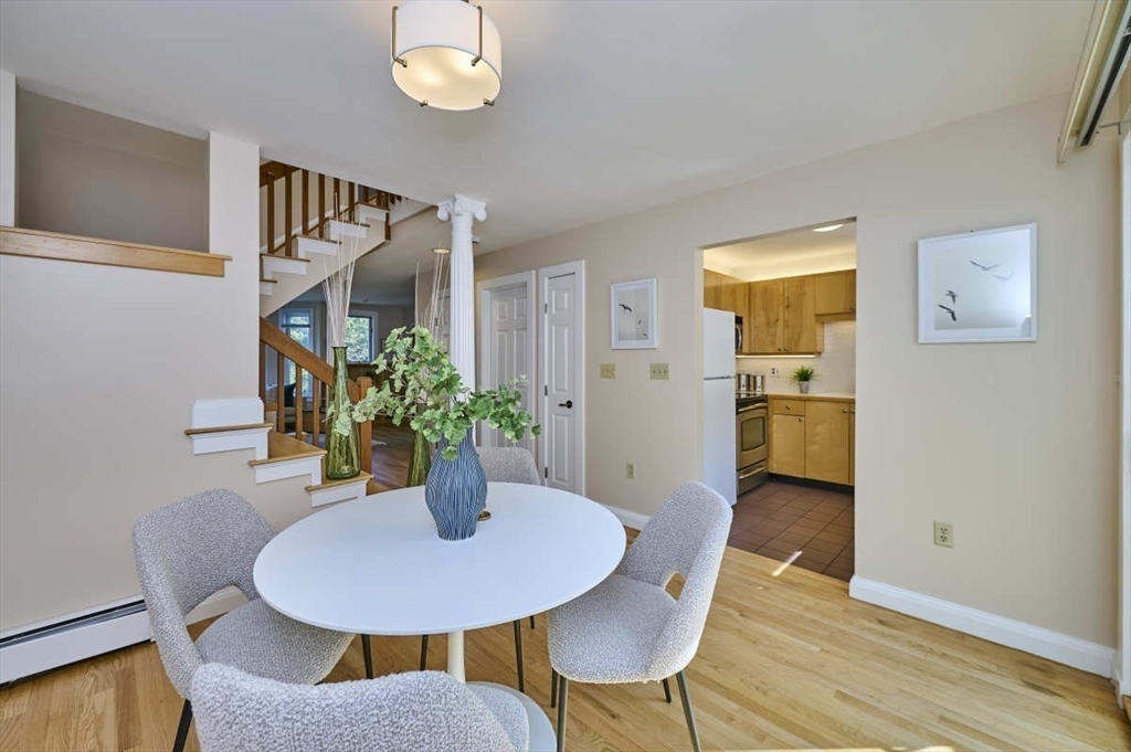 626 Washington Street, Unit 4 Brookline, MA 02446 - Photo 6 of 37 a view of a dining room with furniture and wooden floor