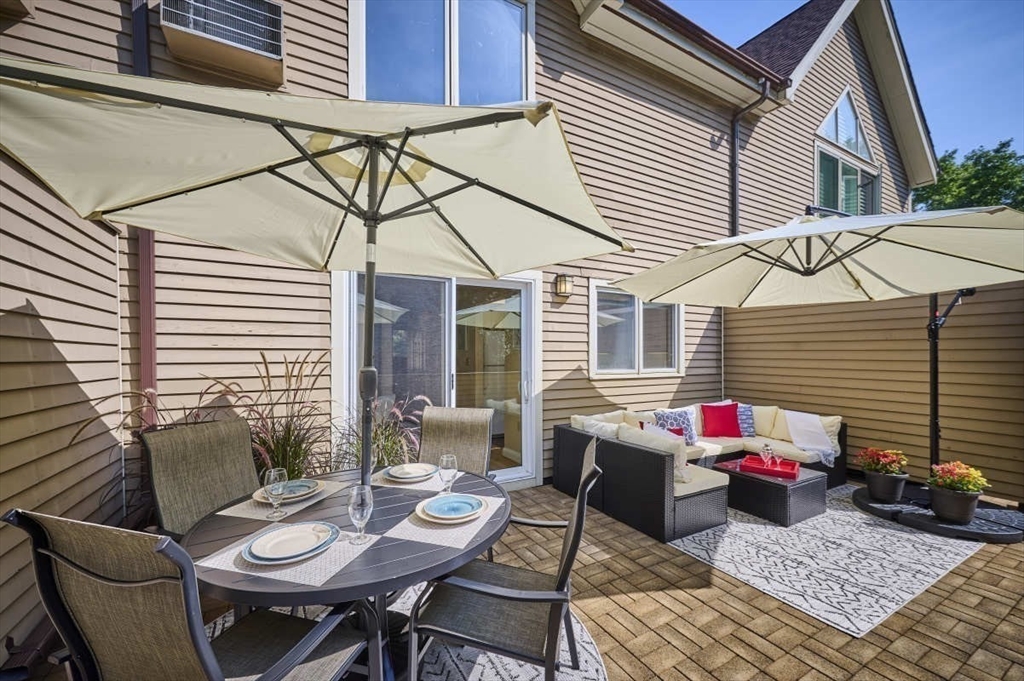 626 Washington Street, Unit 4 Brookline, MA 02446 - Photo 9 of 37 a view of a patio with couple of chairs and a table