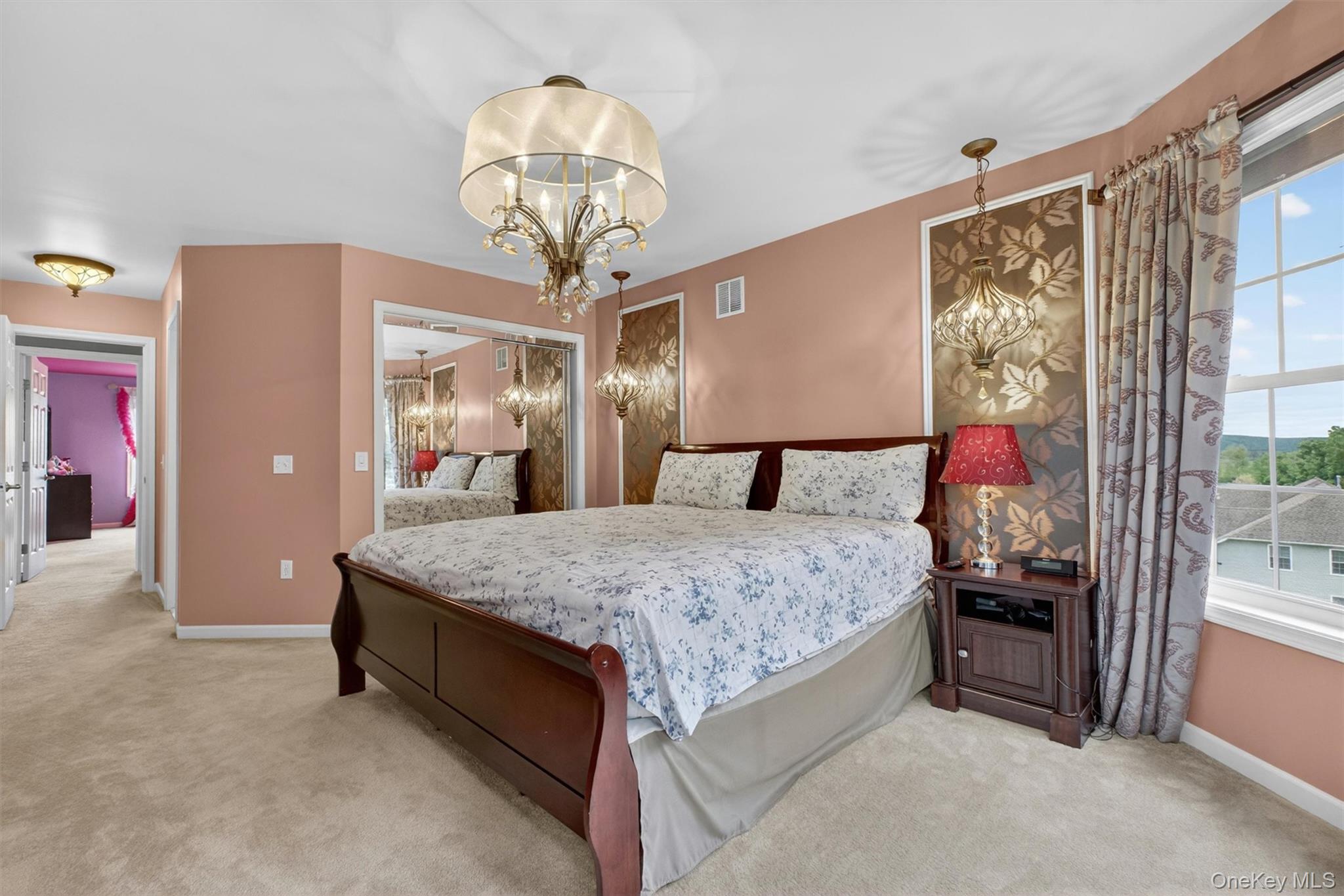 219 Country Club Road Hopewell Junction, NY 12533 - Photo 35 of 49 a bedroom with a bed and a chandelier