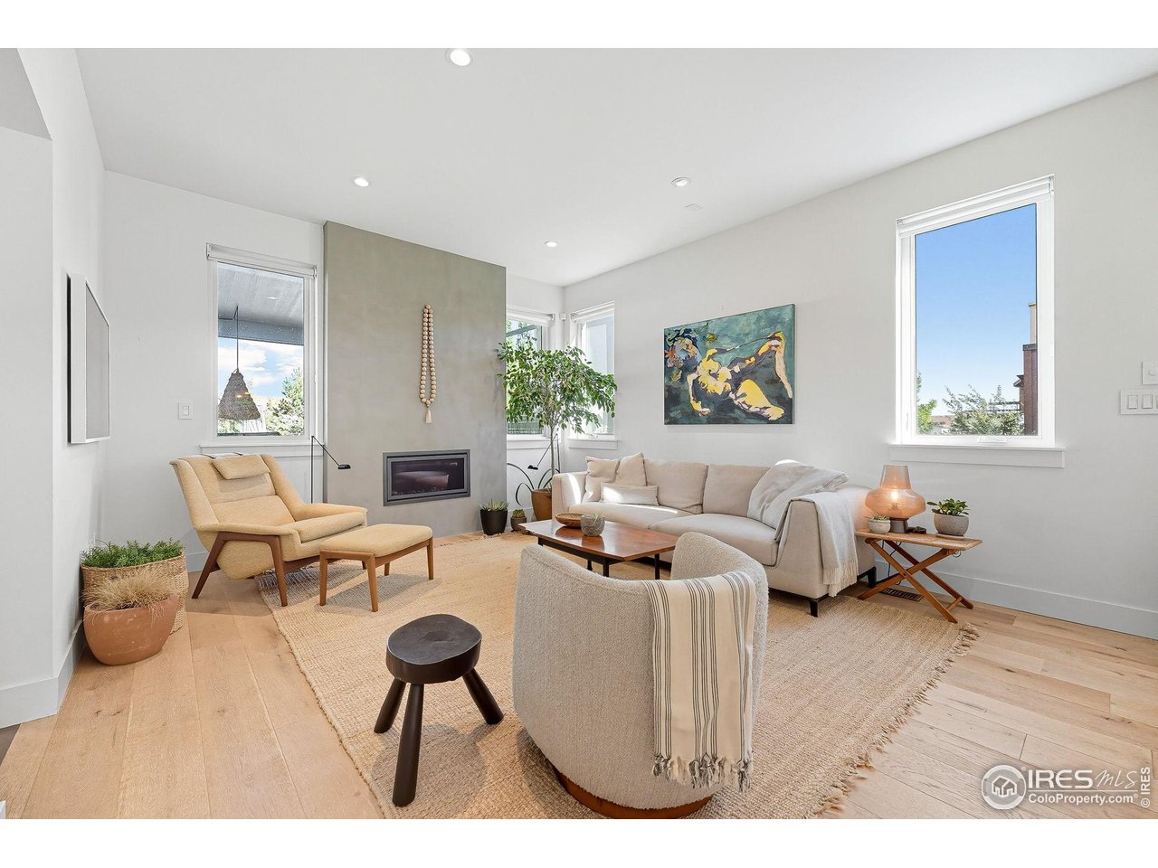 4740 8th Street Boulder, CO 80304 - Photo 12 of 50 a living room with furniture a fireplace and a table
