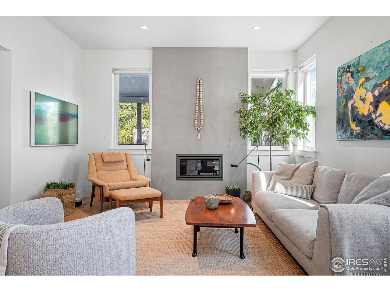 4740 8th Street Boulder, CO 80304 - Photo 13 of 50 a living room with furniture a flat screen tv and a fireplace