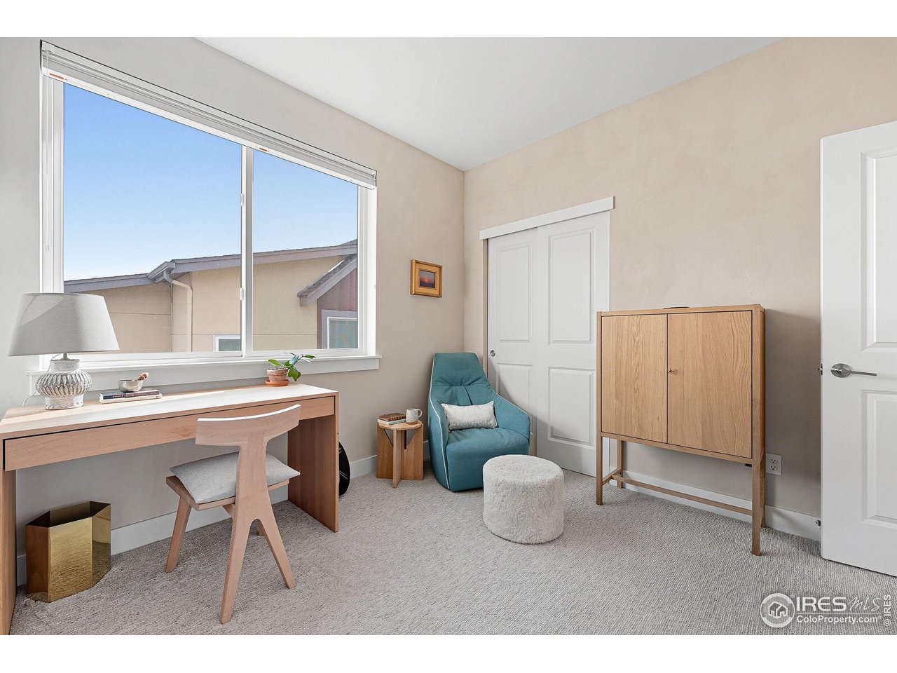 4740 8th Street Boulder, CO 80304 - Photo 17 of 50 a room with a table chairs and a refrigerator