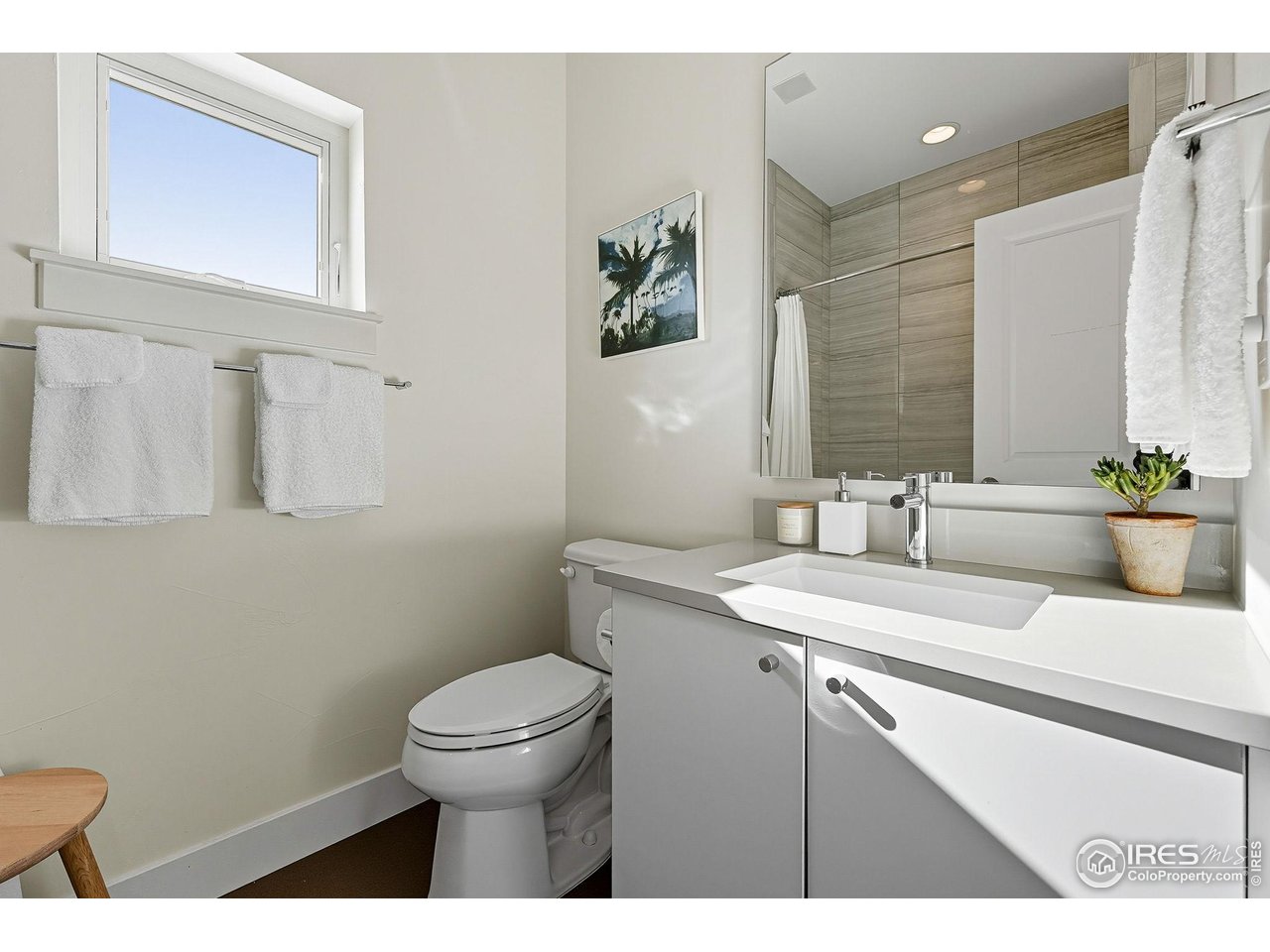 4740 8th Street Boulder, CO 80304 - Photo 21 of 50 a bathroom with a sink a toilet and mirror
