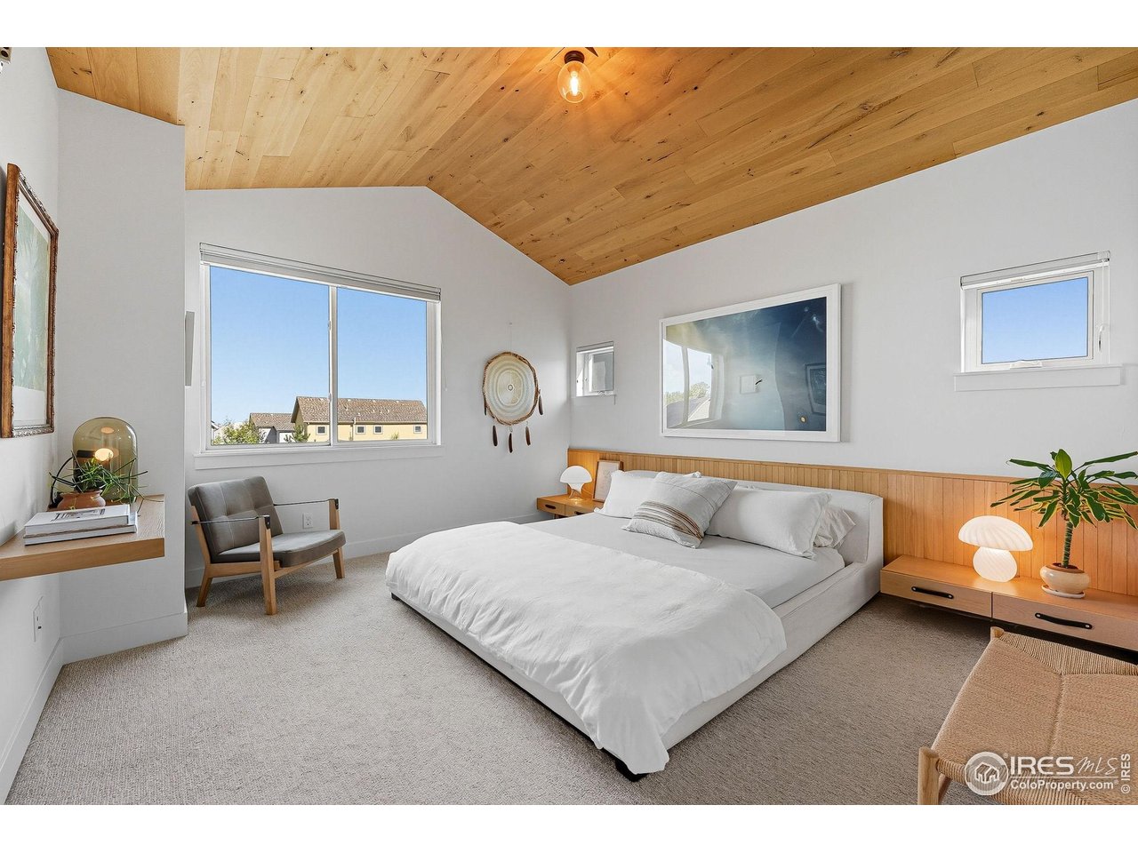 4740 8th Street Boulder, CO 80304 - Photo 23 of 50 a bedroom with a bed and furniture