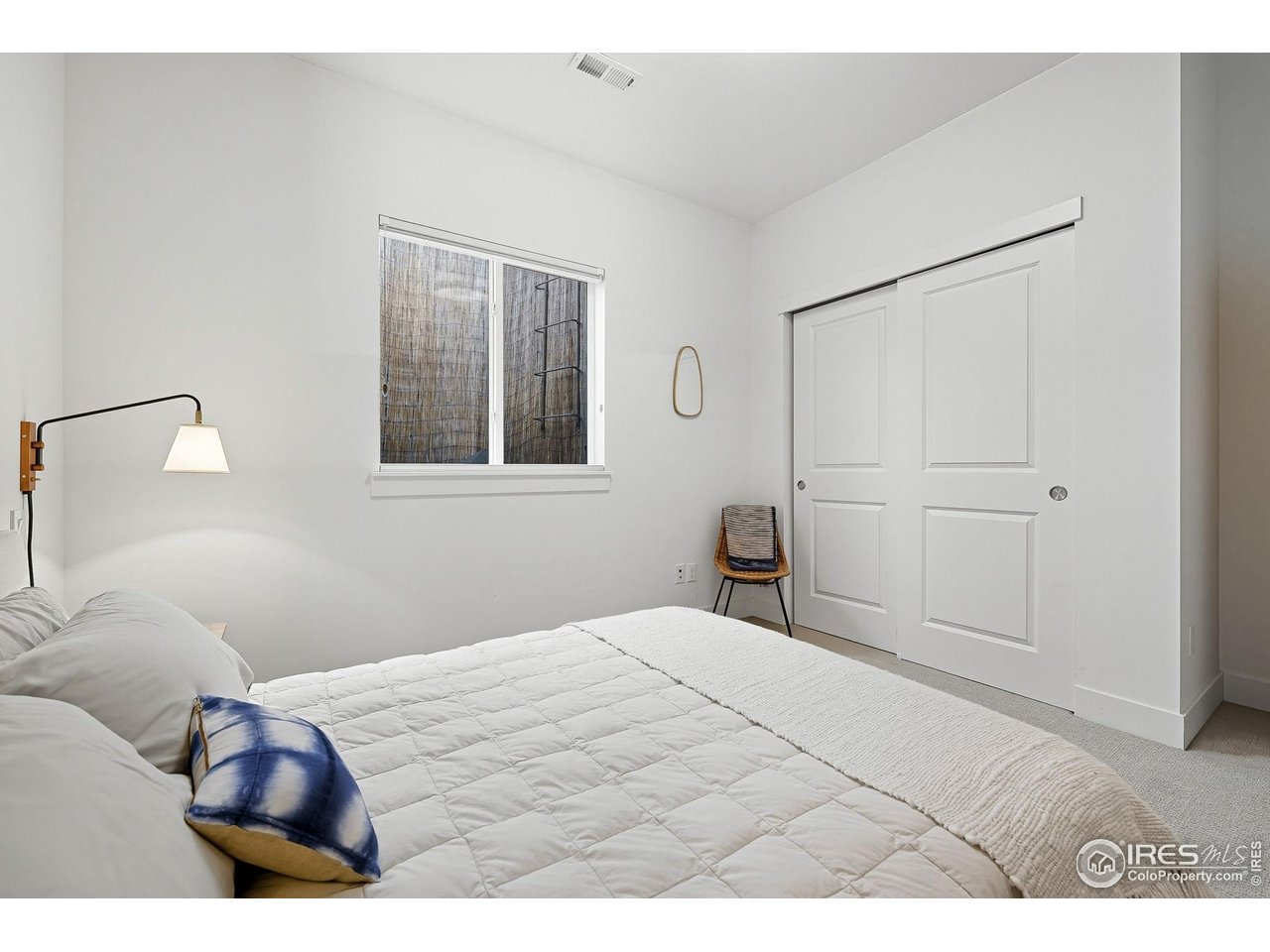 4740 8th Street Boulder, CO 80304 - Photo 35 of 50 a bedroom with a bed and a painting