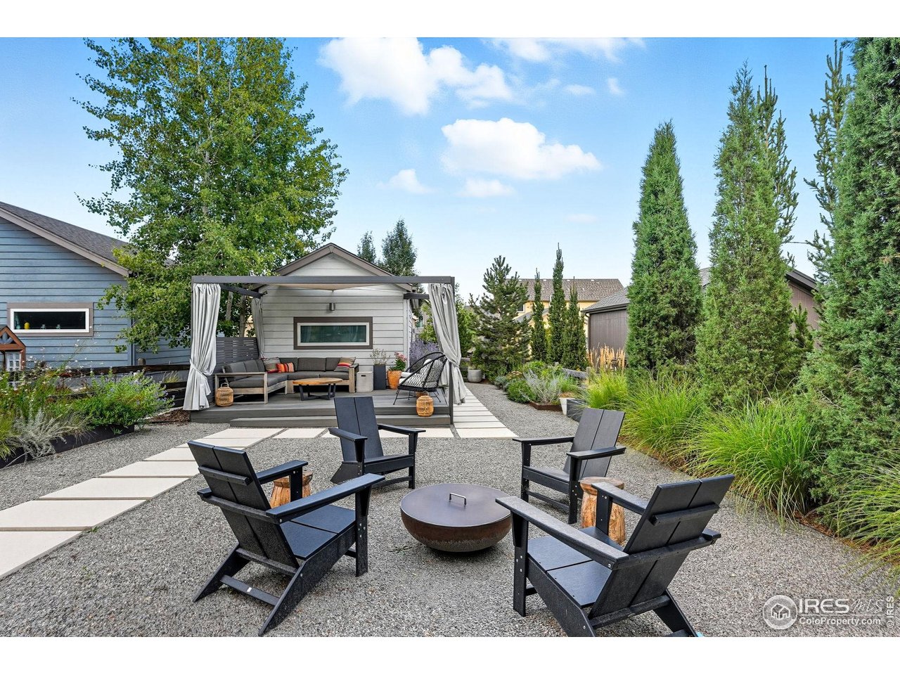 4740 8th Street Boulder, CO 80304 - Photo 40 of 50 a backyard of a house with table and chairs