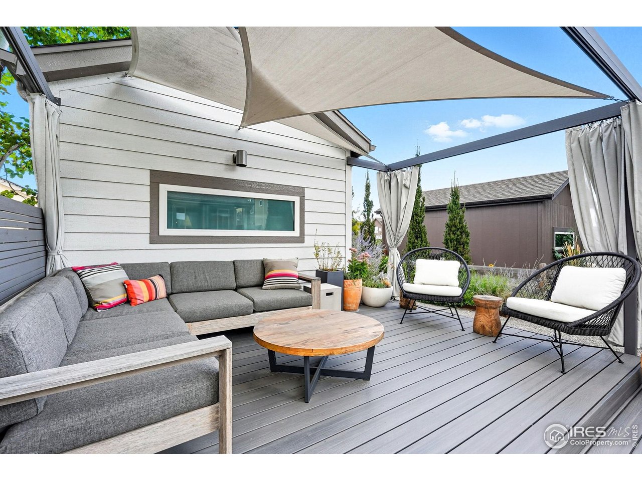 4740 8th Street Boulder, CO 80304 - Photo 41 of 50 a outdoor living space with furniture and a wooden floor