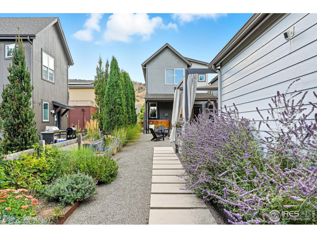 4740 8th Street Boulder, CO 80304 - Photo 42 of 50 a front view of a house with a yard and outdoor seating