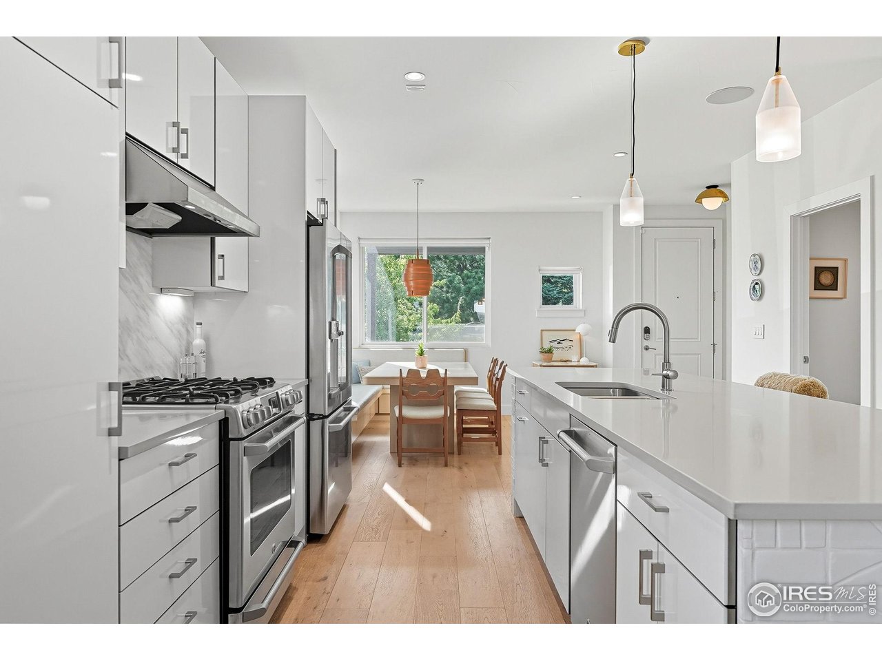 4740 8th Street Boulder, CO 80304 - Photo 9 of 50 a kitchen with sink stove and cabinets