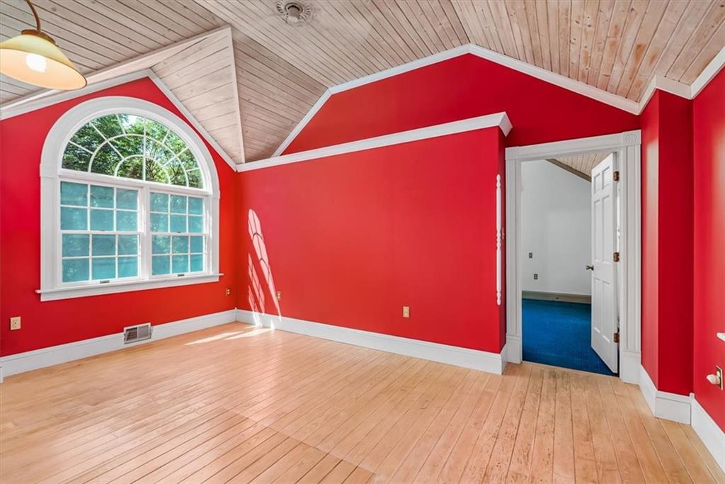 4104 Ben Miller Road Gibsonia, PA 15044 - Photo 21 of 38 a view of empty room with wooden floor and fan