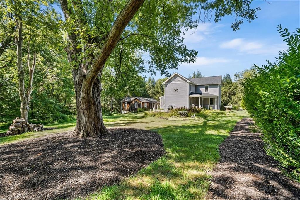 4104 Ben Miller Road Gibsonia, PA 15044 - Photo 34 of 38 a front view of a house with a yard