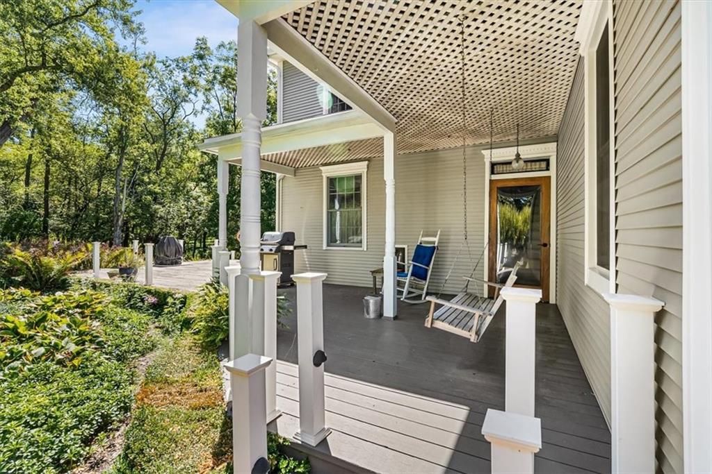 4104 Ben Miller Road Gibsonia, PA 15044 - Photo 36 of 38 a view of a patio with couches table and chairs and wooden floor