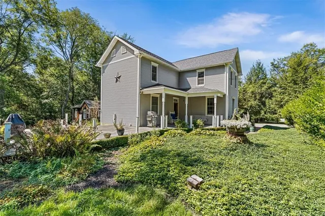 a front view of a house with garden