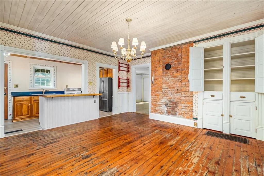 4104 Ben Miller Road Gibsonia, PA 15044 - Photo 8 of 38 a view of an empty room with cabinet and a window