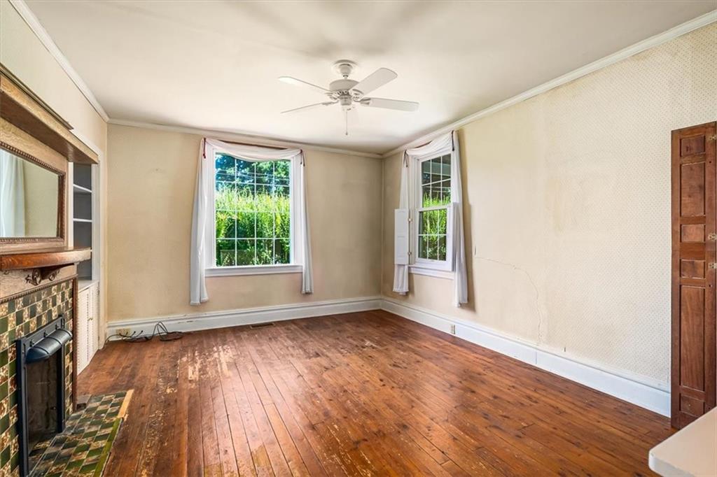 4104 Ben Miller Road Gibsonia, PA 15044 - Photo 9 of 38 a view of an empty room with wooden floor and a window