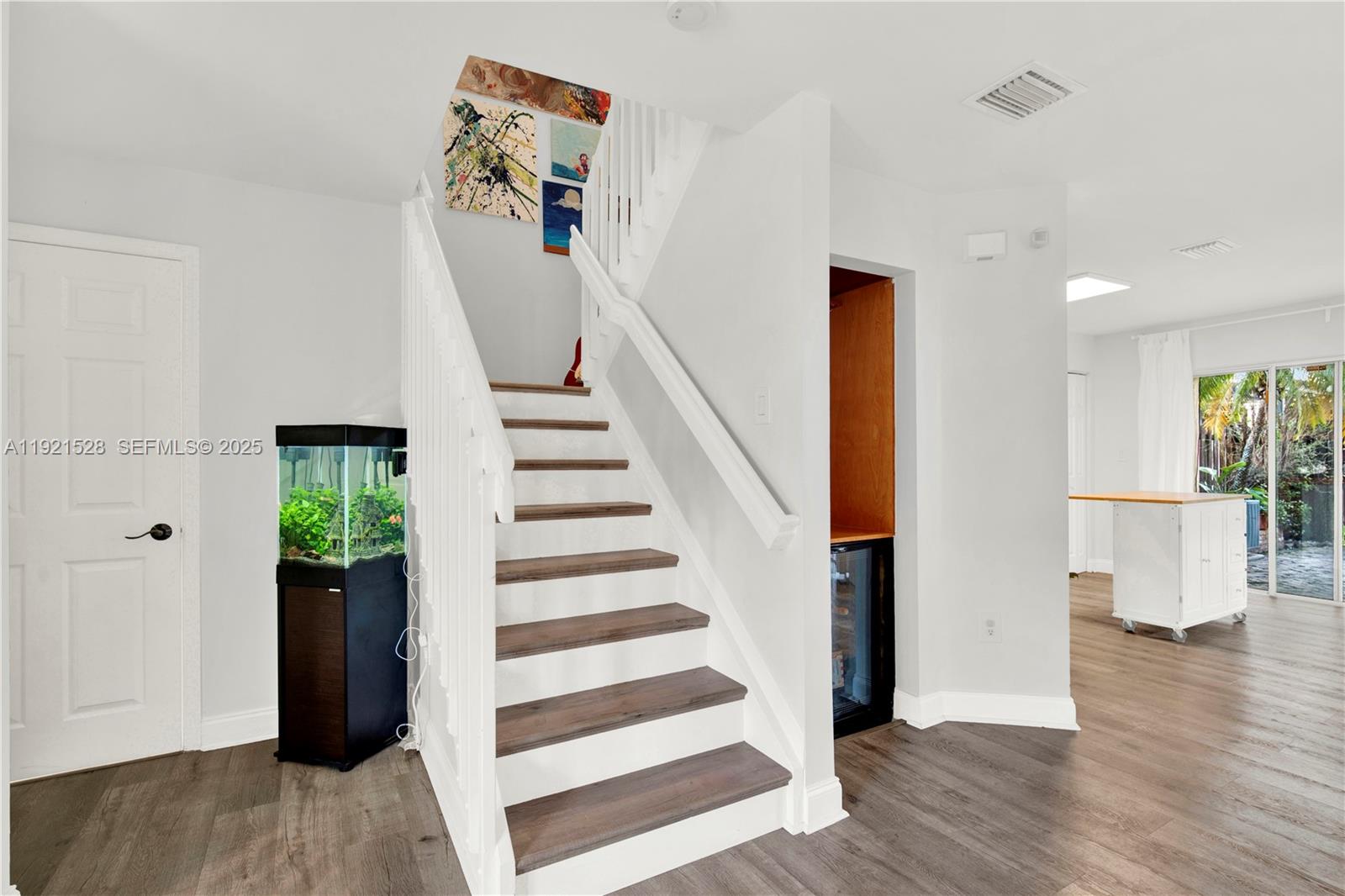 16415 Southwest 73rd Terrace Miami, FL 33193 - Photo 12 of 41 a view of a hallway with wooden floor and entryway