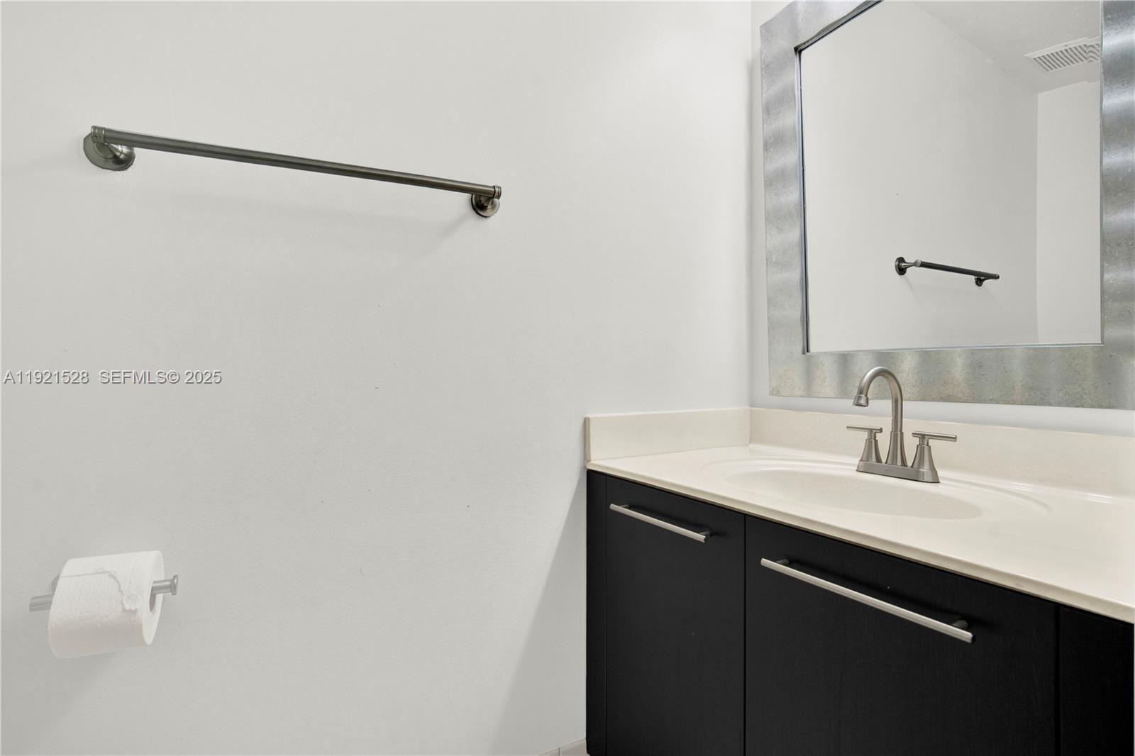 16415 Southwest 73rd Terrace Miami, FL 33193 - Photo 13 of 41 a bathroom with a sink and a mirror