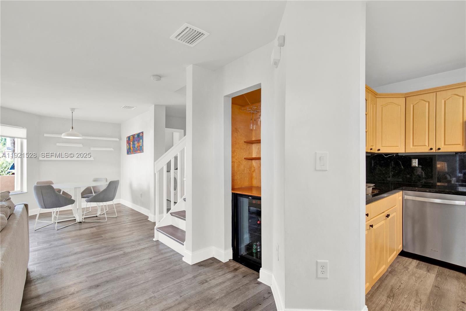 16415 Southwest 73rd Terrace Miami, FL 33193 - Photo 17 of 41 a kitchen with stainless steel appliances wooden floor and a window