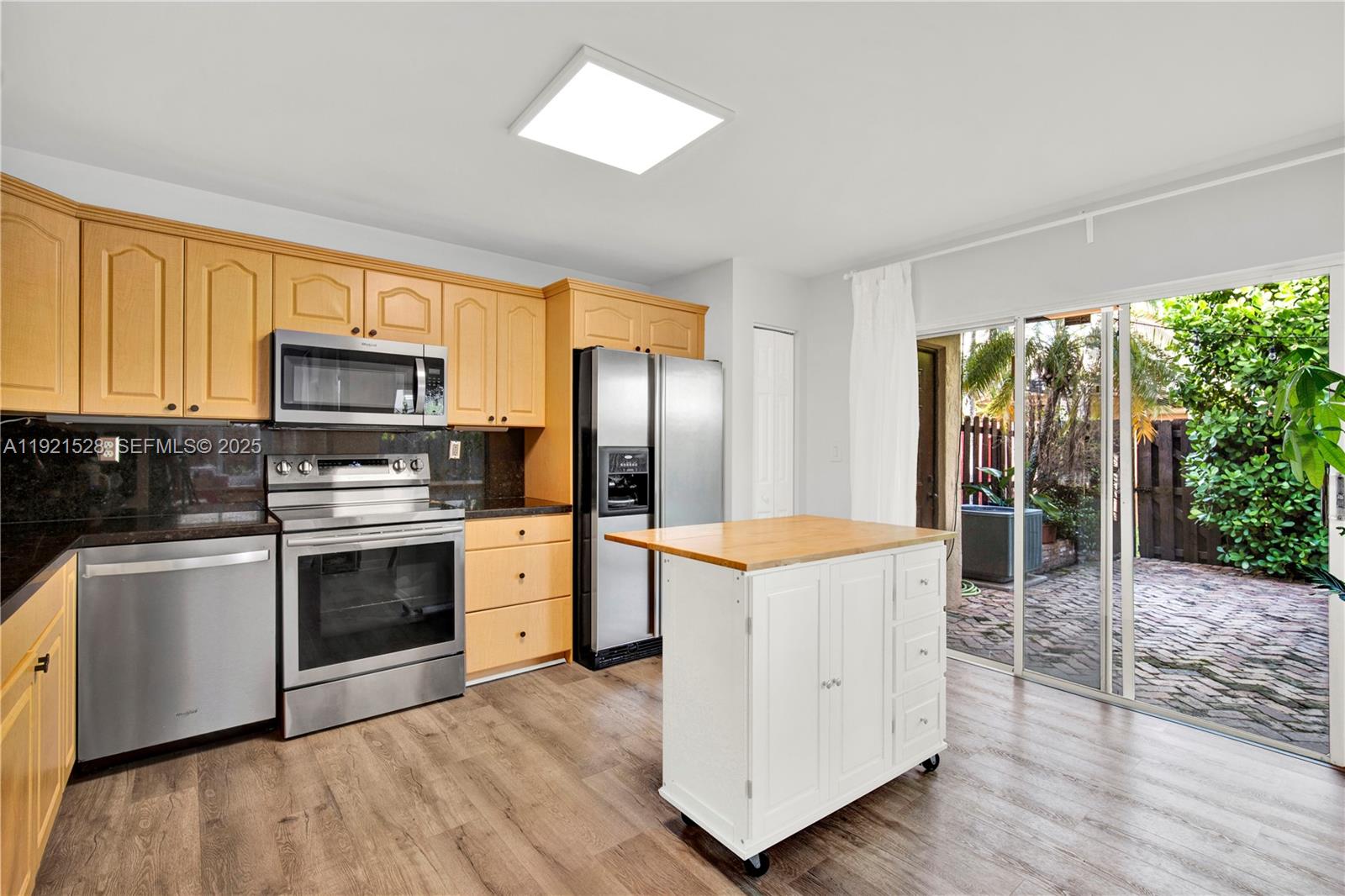 16415 Southwest 73rd Terrace Miami, FL 33193 - Photo 18 of 41 a kitchen with stainless steel appliances granite countertop a stove a sink and a refrigerator