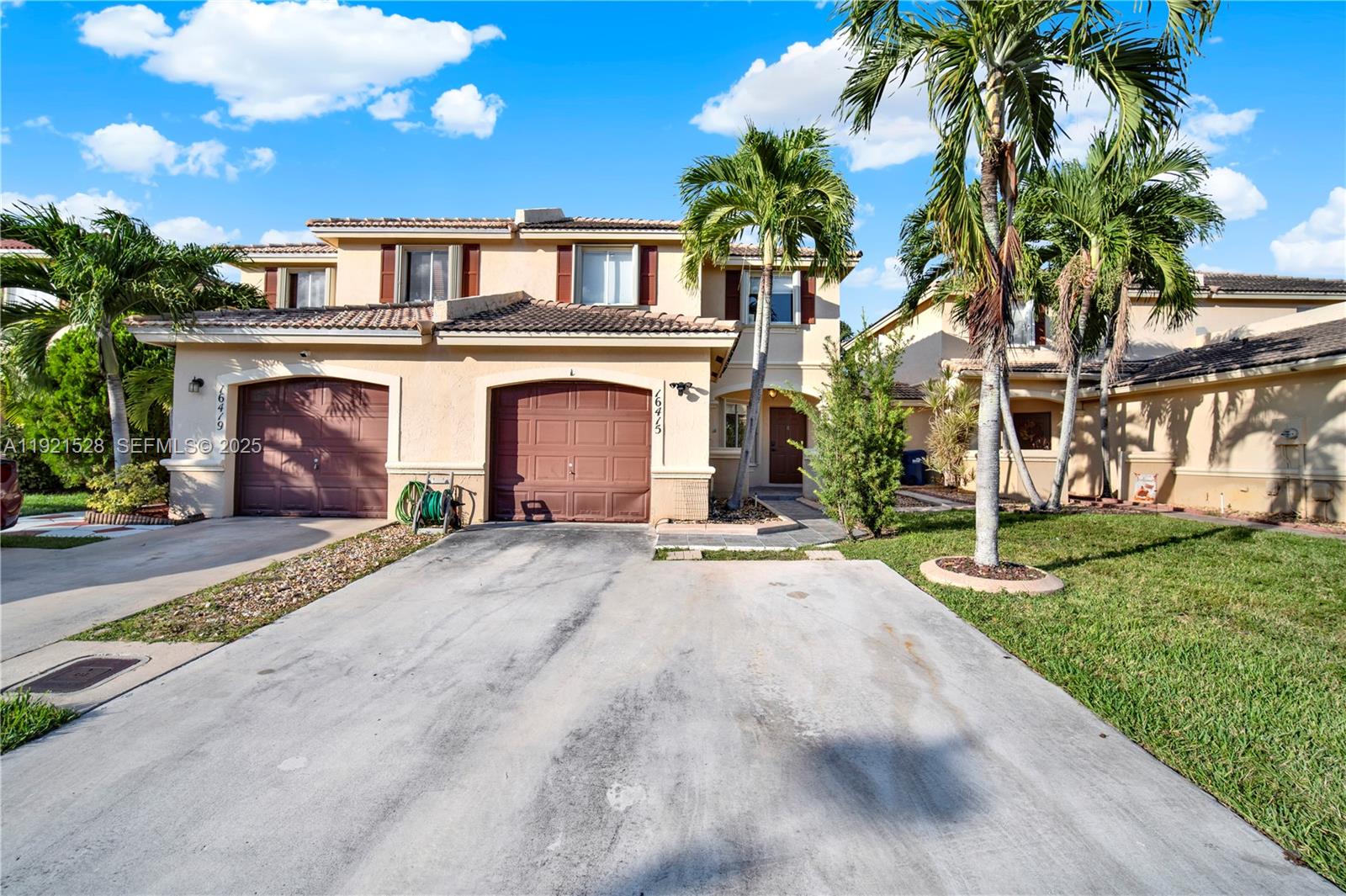 16415 Southwest 73rd Terrace Miami, FL 33193 - Photo 2 of 41 a front view of a house with a yard and garage